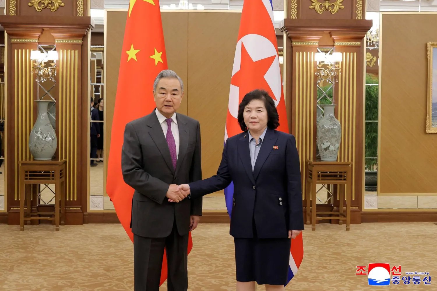 This picture taken on April 9, 2026 and released by North Korea's official Korean Central News Agency (KCNA) on April 10, 2026 shows Chinese Foreign Minister Wang Yi (L) shaking hands with North Korean Foreign Minister Choe Son Hui at the Geumsusan Guesthouse in Pyongyang.  (KCNA via KNS / AFP)\