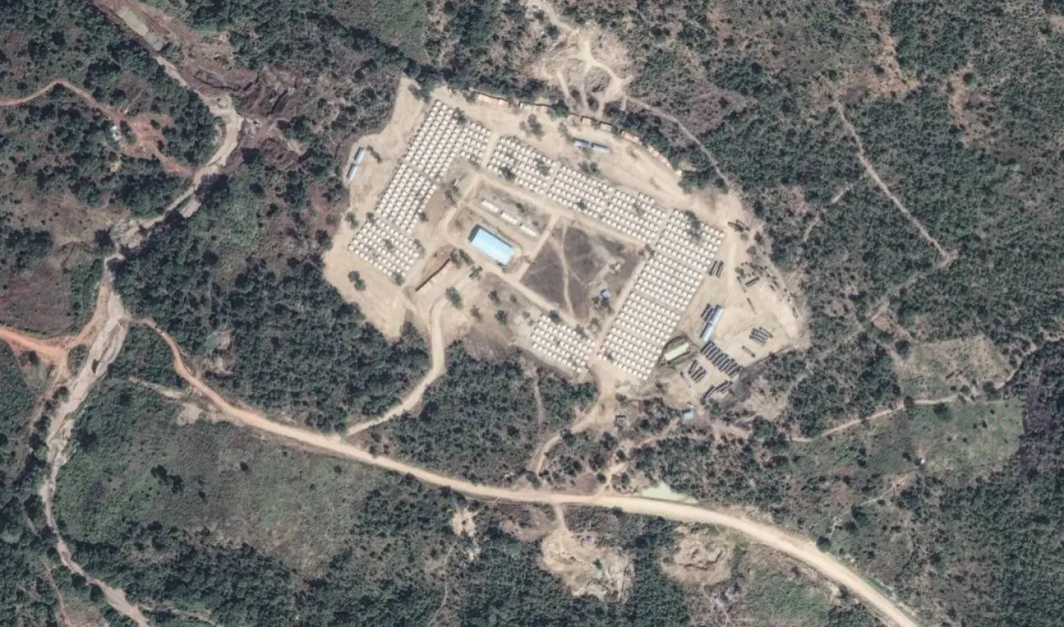Satellite imagery taken on January 22, 2026 shows a camp with hundreds of tents and an area to the north where trucks come and go in Benishangul-Gumuz, Ethiopia. Source: Vantor