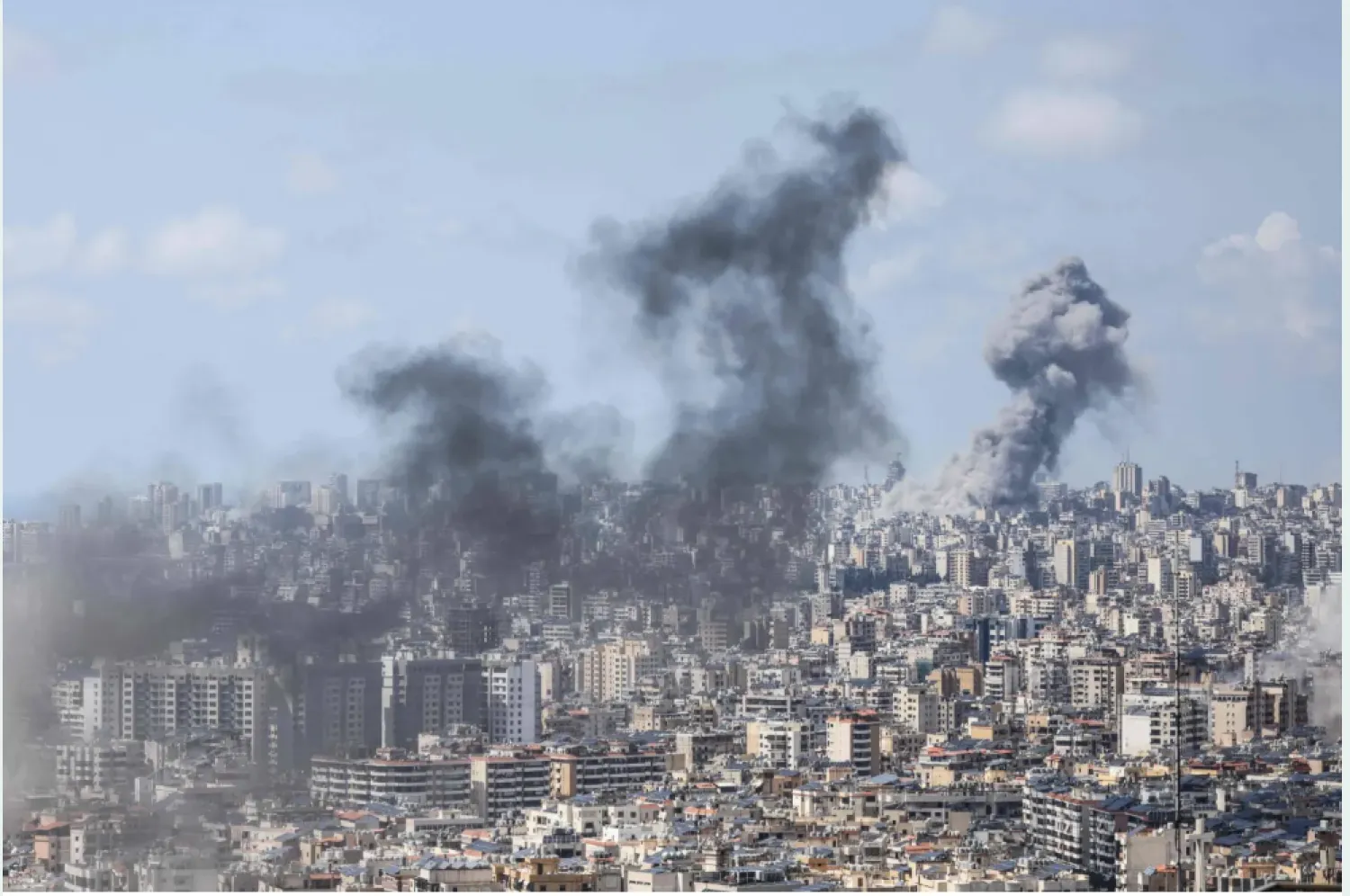 Smoke rising from the sites of Israeli air raids on Beirut and the southern suburb last Wednesday (AFP)