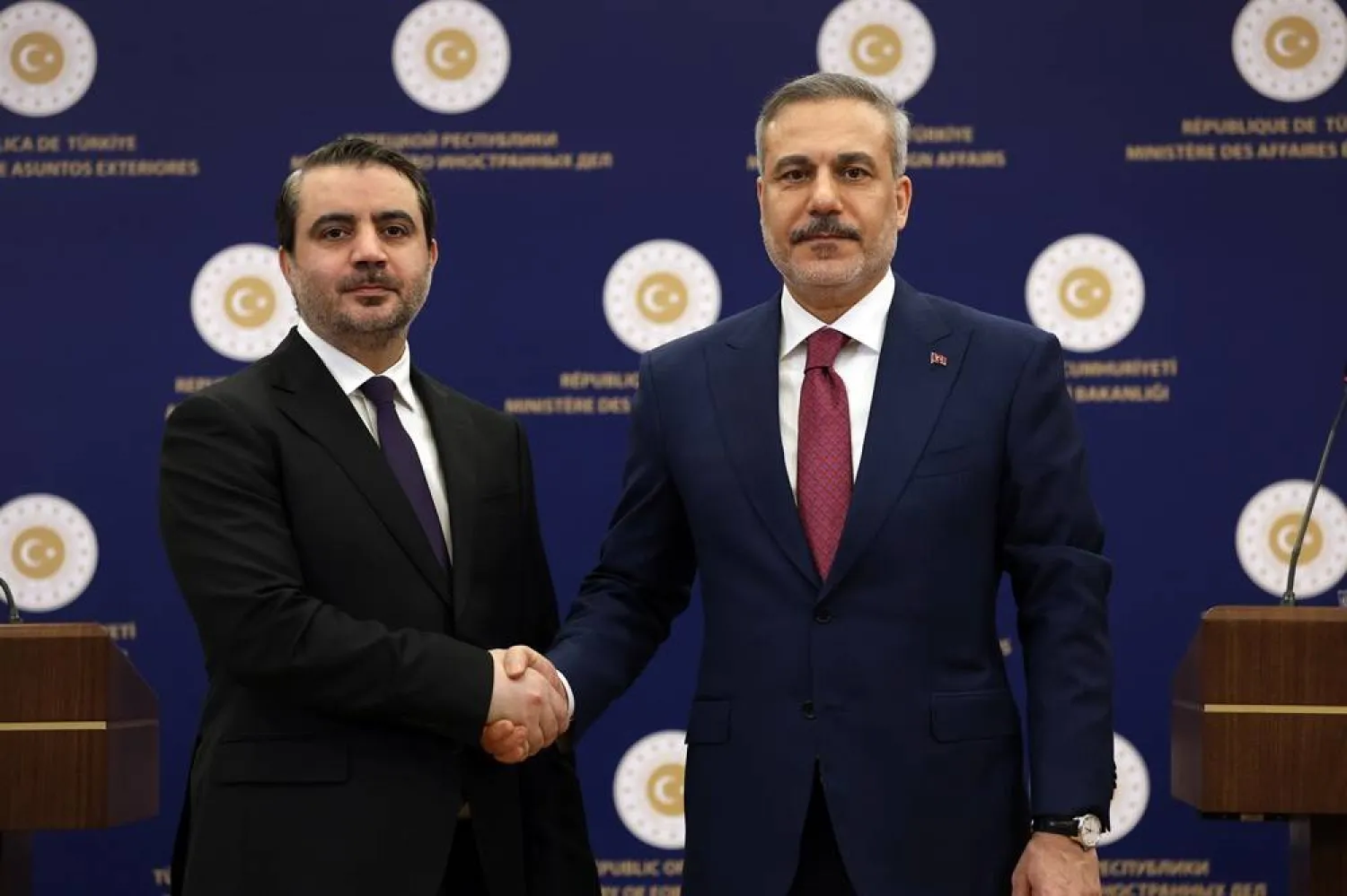 Turkish Foreign Minister Hakan Fidan (R) and Syrian Foreign Minister Asaad al-Shaibani shake hands during a joint press conference after their meeting in Ankara, Türkiye, 09 April 2026. (EPA) 