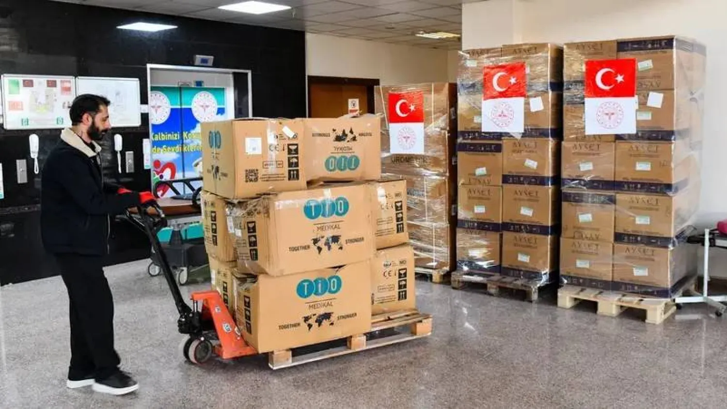 A worker moves a pallet of medical cardboard boxes as Turkish Health Ministry plans to send medical supplies in Iran in Van, north-eastern Türkiye, on April 8, 2026. (AFP) 