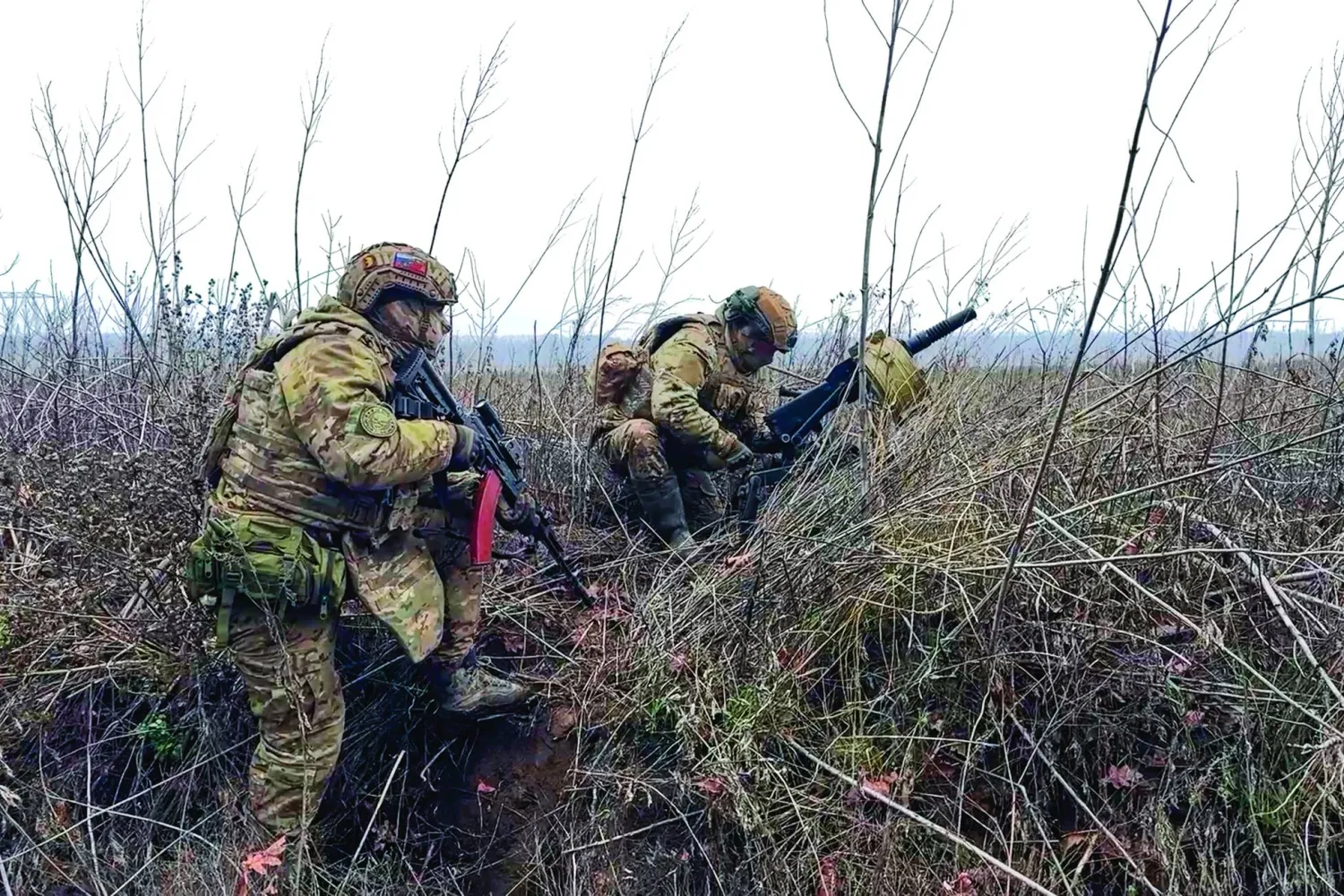 In this image made from video provided by Russian Defense Ministry Press Service on Tuesday, March 31, 2026, Russian soldiers prepare to fire a grenade launcher towards Ukrainian positions on an undisclosed location in Ukraine. (Russian Defense Ministry Press Service via AP)