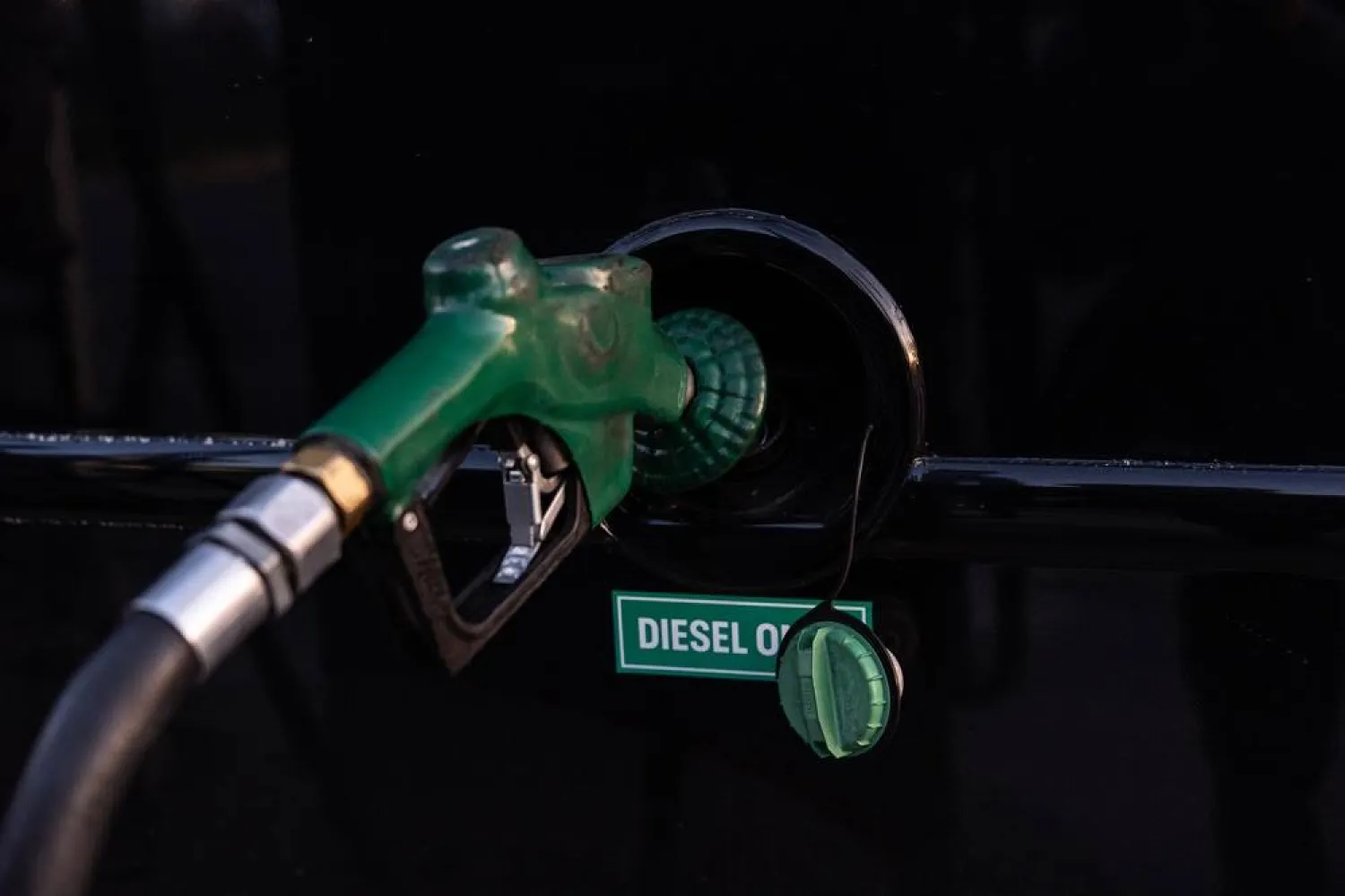  A nozzle pumps diesel into the fuel tank of bus in Orange, Calif., Tuesday, April 7, 2026. (AP) 