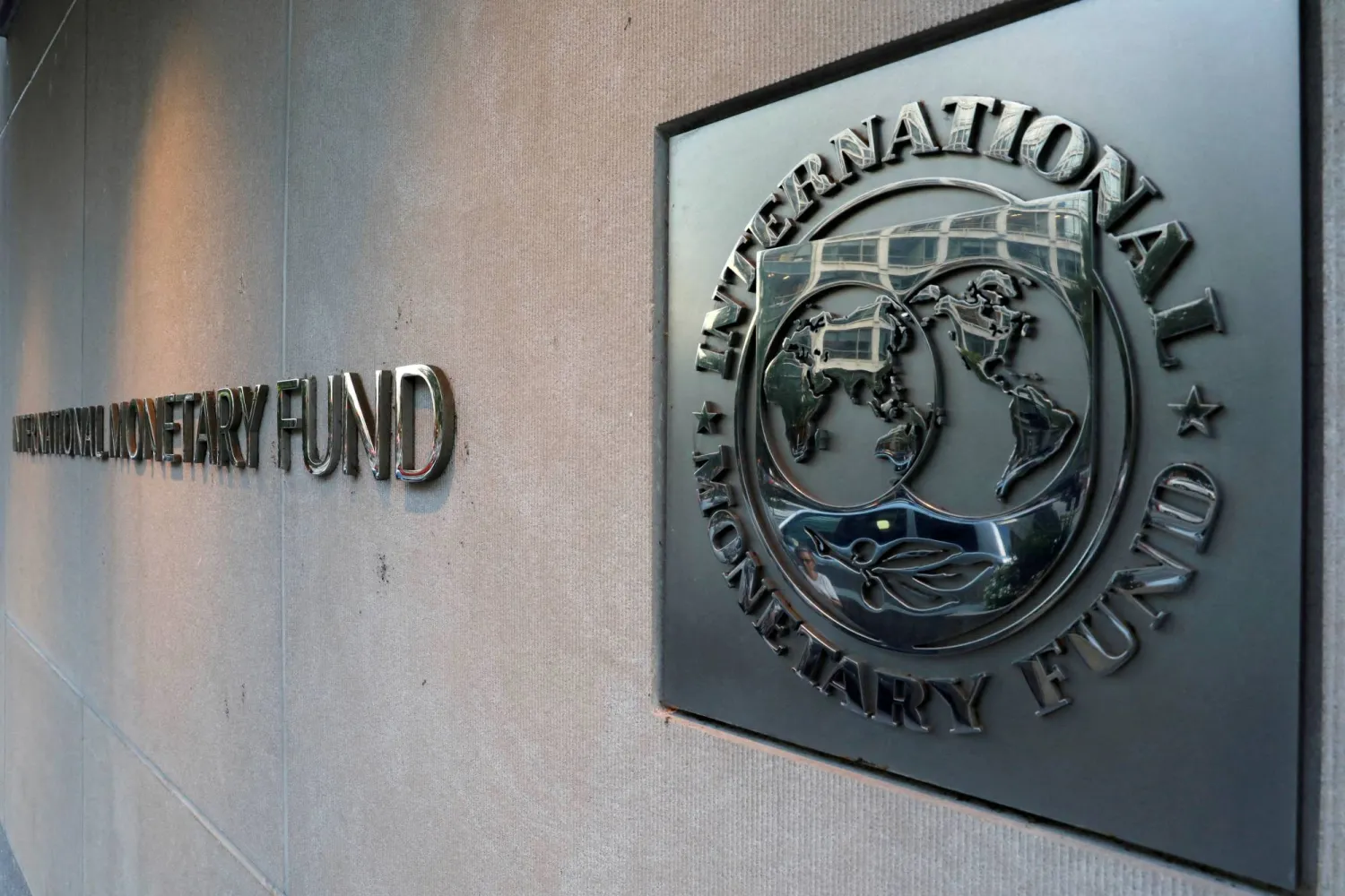 FILE PHOTO: International Monetary Fund (IMF) logo is seen outside the headquarters building in Washington, US, September 4, 2018. REUTERS/Yuri Gripas/File Photo