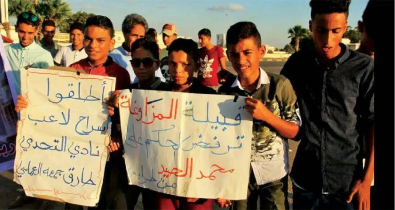 جانب من وقفة احتجاجية للإفراج عن اللاعبين الليبيين (صفحات لأُسَر اللاعبين)