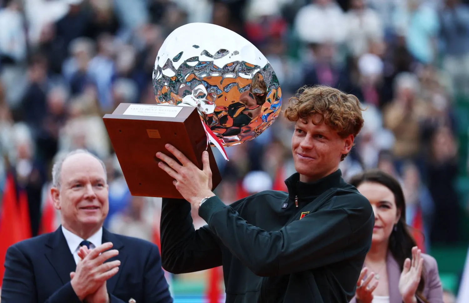 Tennis - ATP Masters 1000 - Monte Carlo Masters - Monte Carlo Country Club, Roquebrune-Cap-Martin, France - April 12, 2026 Italy's Jannik Sinner celebrates with the trophy after winning his final match against Spain's Carlos Alcaraz REUTERS/Manon Cruz