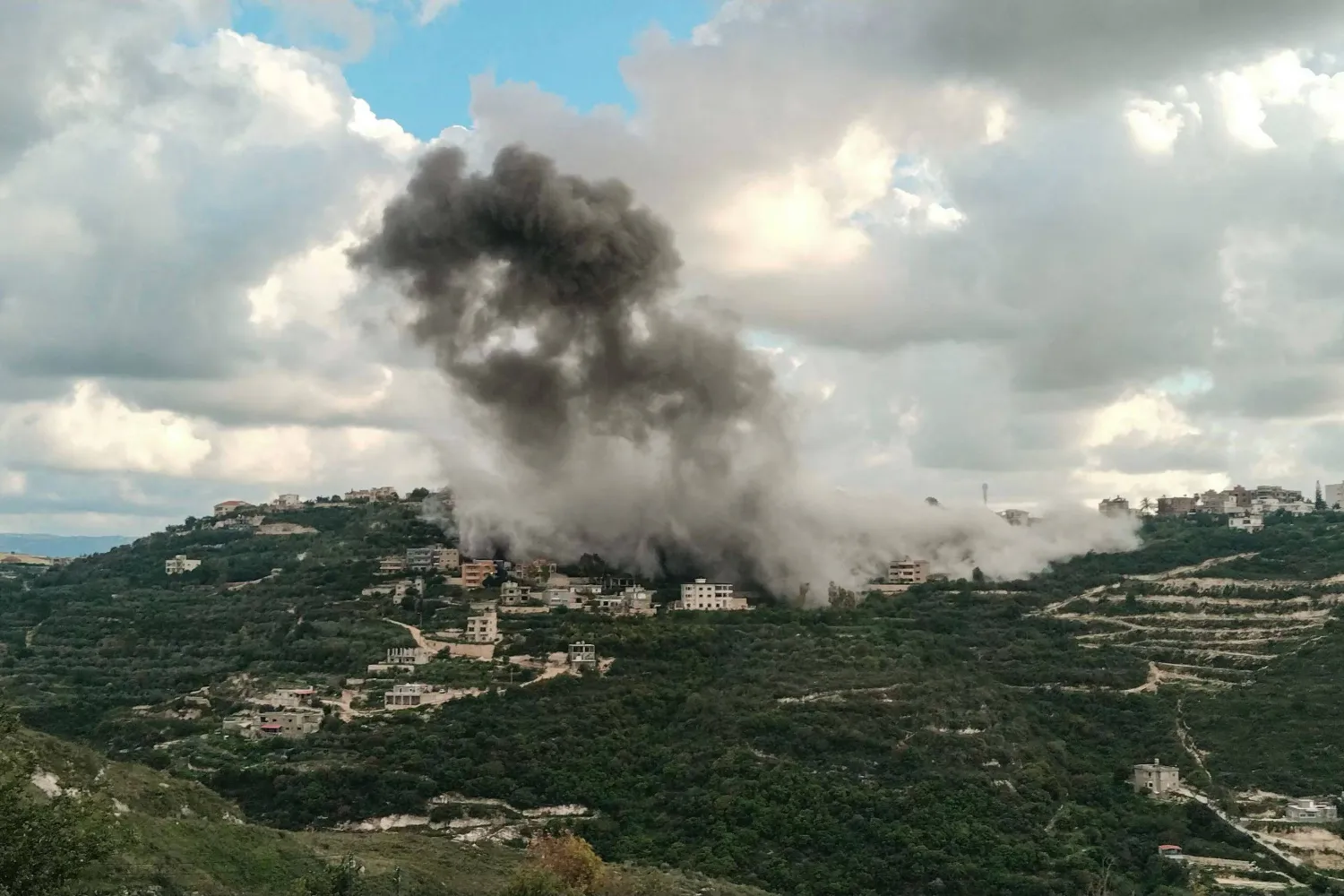 Smoke rises from the site of an Israeli airstrike that targeted the southern Lebanese village of Deik Qanoun al-Nahr on April 12, 2026. (Photo by Kawnat HAJU / AFP)