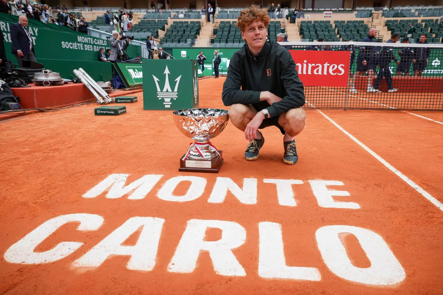 Italy's Jannik Sinner poses with the trophy after winning the Monte Carlo ATP Masters Series Tournament final tennis match against Spain's Carlos Alcaraz on Court Rainier III at the Monte-Carlo Country Club in Roquebrune-Cap-Martin, south-eastern France on April 12, 2026. (Photo by Valery HACHE / AFP)