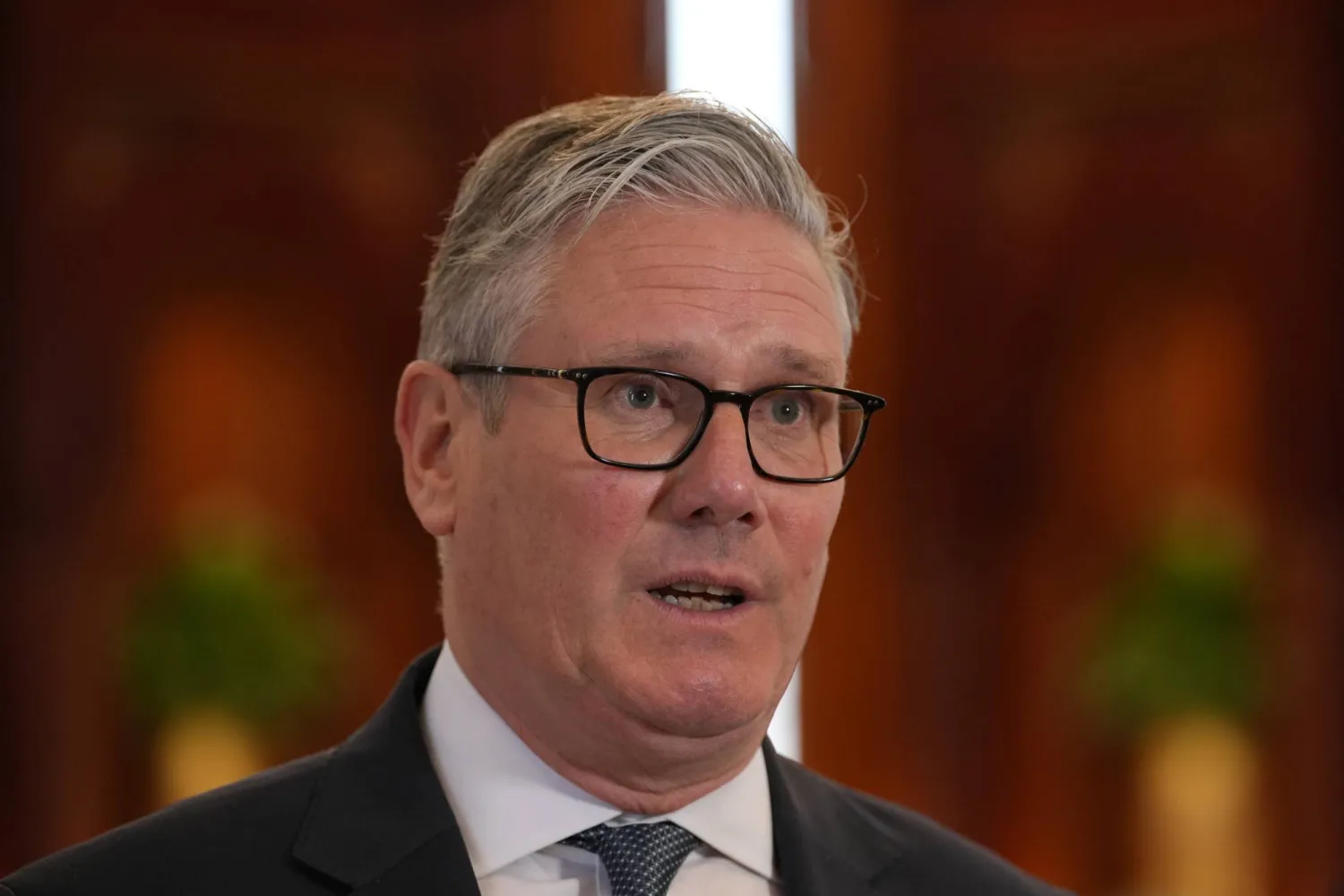 Britain's Prime Minister Keir Starmer speaks to the media at the airport in Doha, Qatar, Friday, April 10, 2026 after his three-day visit to the Gulf region.(AP Photo/Alastair Grant, Pool)