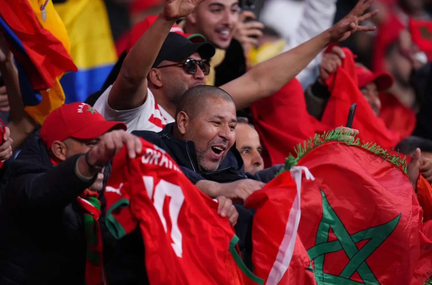 Moroccan fans cheer during a friendly soccer match between Morocco and Ecuador in Madrid, Spain, Friday, March 27, 2026. (AP Photo/Manu Fernandez)