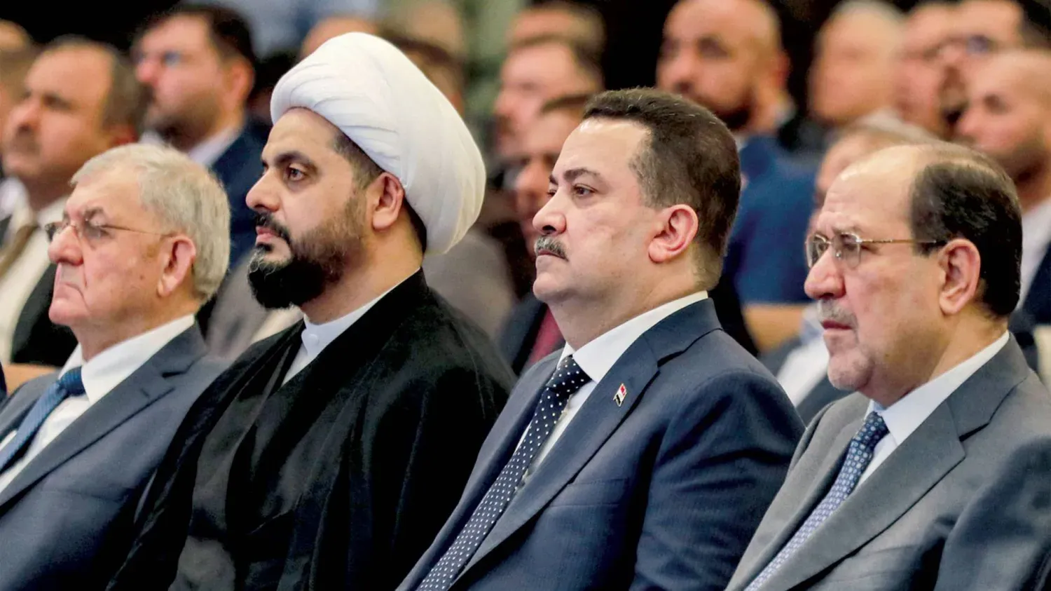 Sudani, Maliki ve Hazali, Bağdat'ta düzenlenen bir toplantıda (Arşiv-AFP)