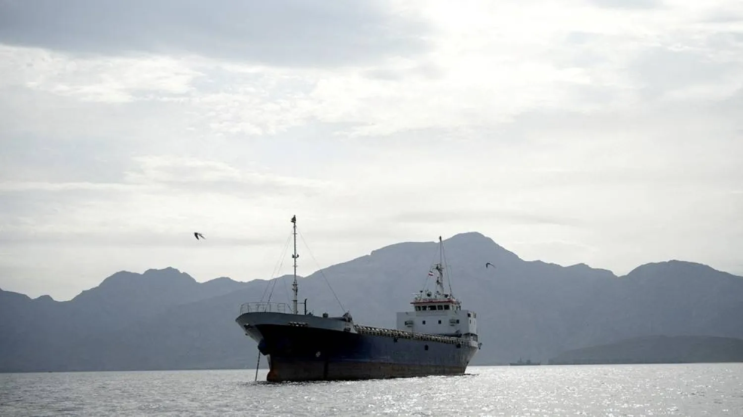 A vessel in the Strait of Hormuz, off the coast of Oman’s Musandam province, April 12, 2026. (Reuters)