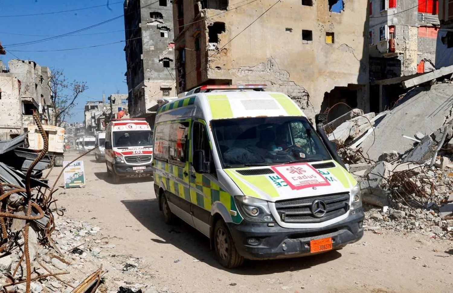 A convoy carrying wounded Palestinians from Gaza for treatment through the Rafah border crossing between Gaza and Egypt, after it was reopened by Israel on Sunday for a limited number of people, rides through Khan Younis in the southern Gaza Strip, April 12, 2026. (Reuters)