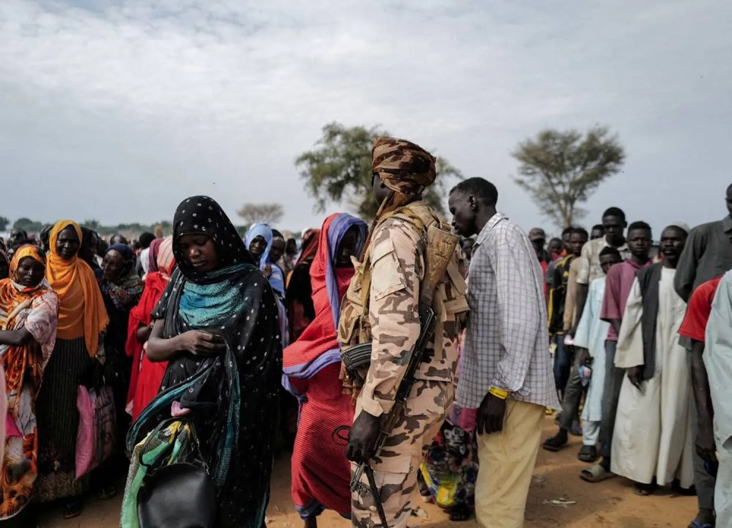 Sudanese refugees, who have fled the violence in their country, line up to receive food rations from World Food Program (WFP), in Adre Chad July 20, 2023. (Reuters)