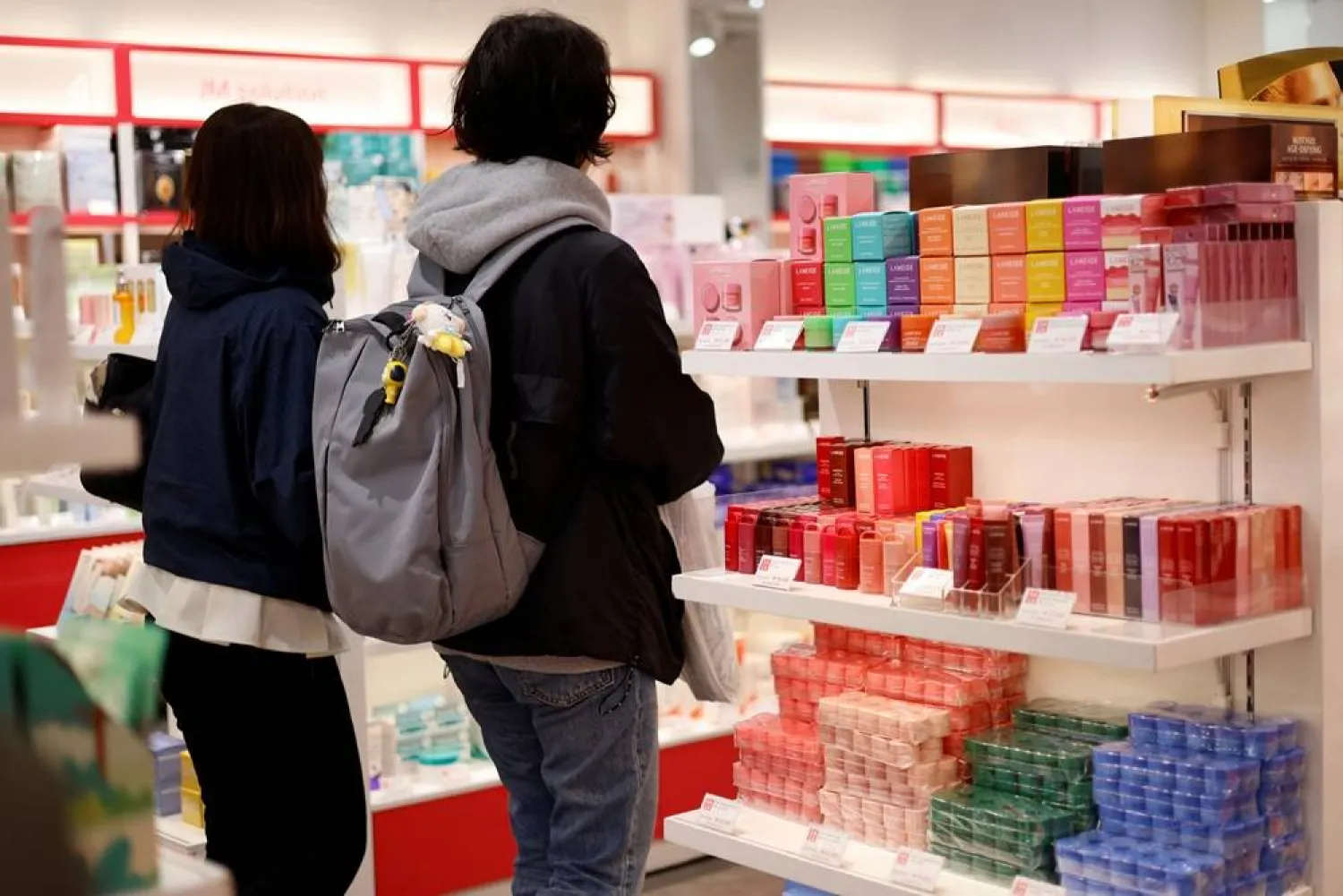  Customers browse cosmetics products inside a cosmetics store at Myeongdong shopping district in Seoul, South Korea, April 10, 2026. (Reuters)