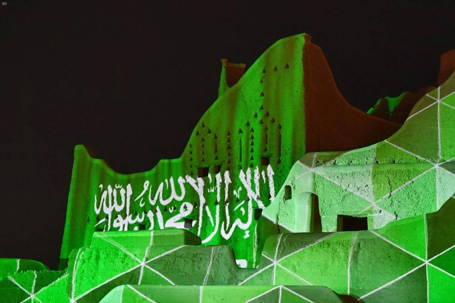 A landmark is lit up in the colors of the national flag in Diriyah on the occasion of Saudi National Day. (SPA file)