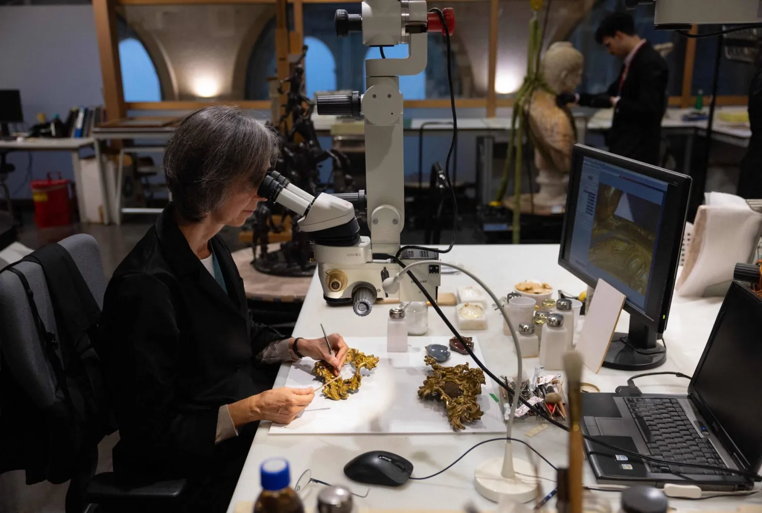 A conservator works on the restoration of gilded moldings at the Prado museum's sculpture restoration department in Madrid on October 23, 2025. (Pierre-Philippe Marcou/ AFP) 