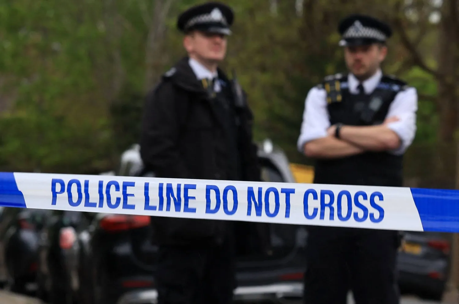 Police officers stand on duty at a cordon near to the Finchley Reform Synagogue, in the North Finchley area of north London, on April 15, 2026, following an attack on the synagogue in the early hours of the morning. (Photo by Toby Shepheard / AFP)