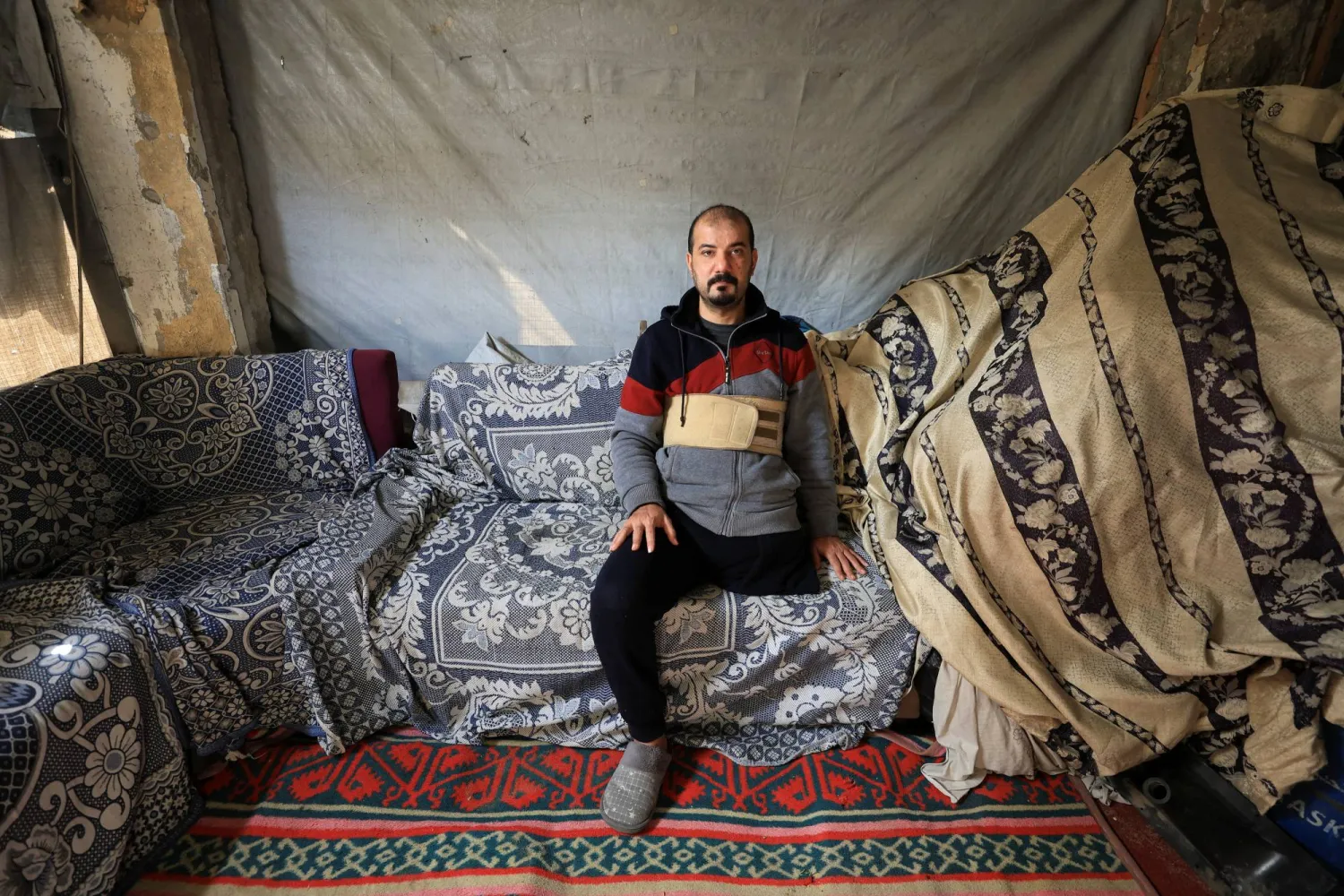 Palestinian amputee Hazem Foura, who lost one leg, sits at his home in Gaza City, April 3, 2026. REUTERS/Dawoud Abu Alkas