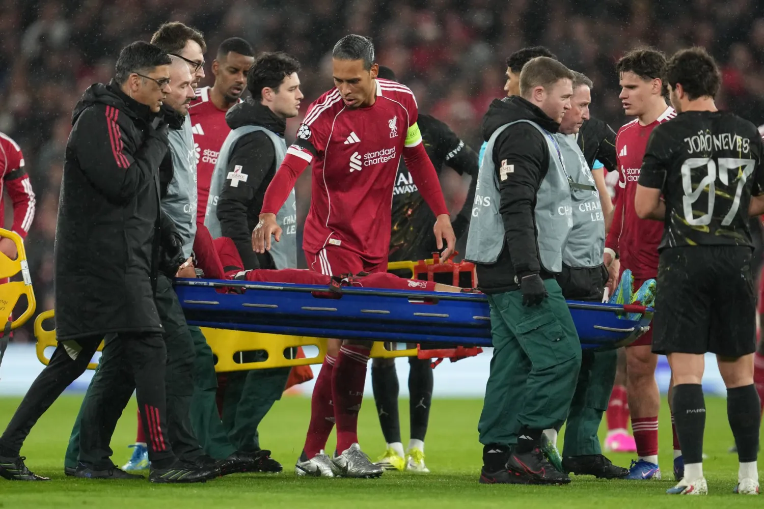 Liverpool's Virgil van Dijk checks on Hugo Ekitike during the Champions League quarterfinal second leg soccer match between Liverpool and Paris Saint-Germain in Liverpool, England, Tuesday, April 14, 2026. (AP Photo/Jon Super) 