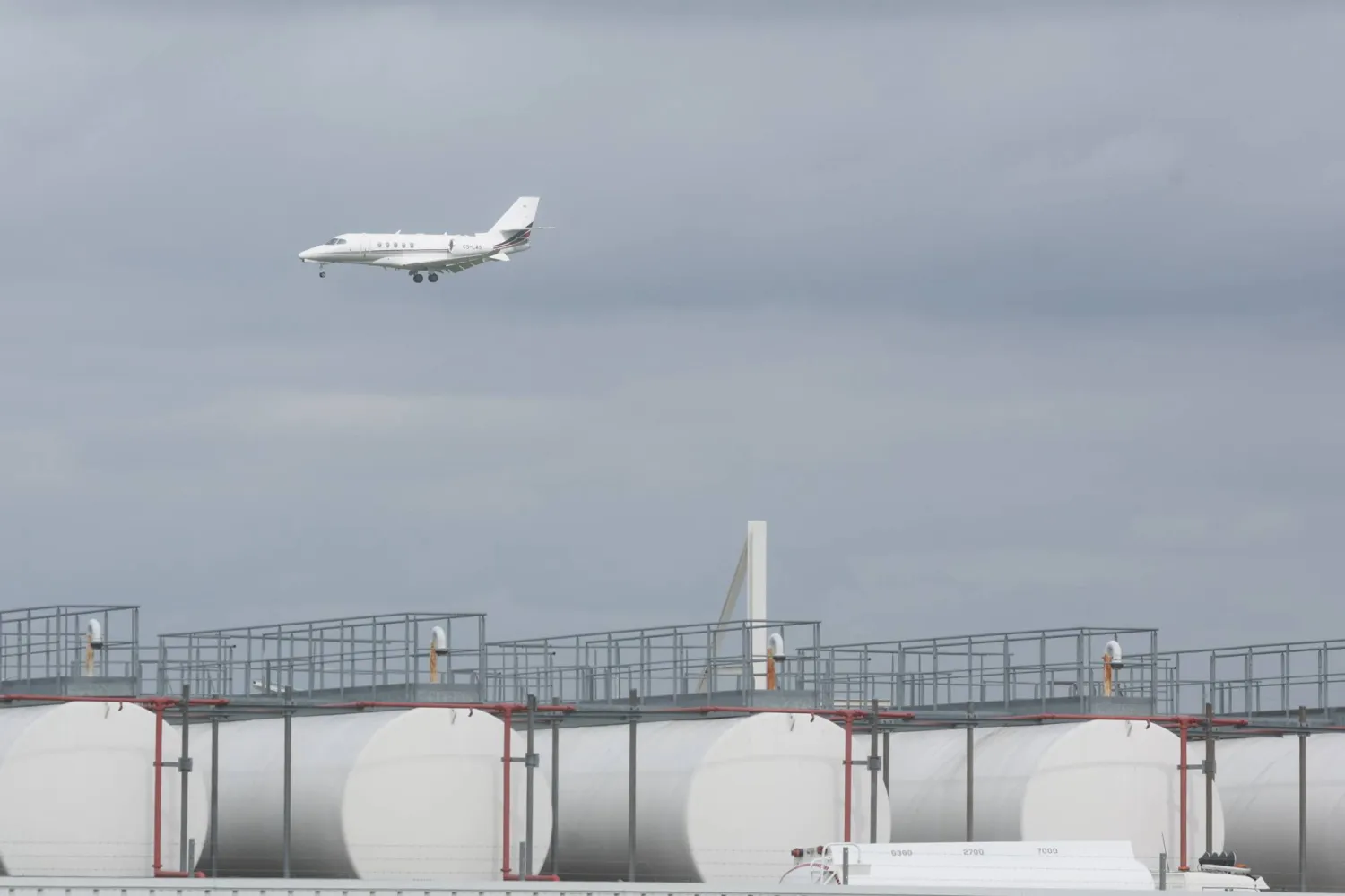  Aircraft pass behind kerosene storage facilities at Liege Airport in Liege, Belgium, 16 April 2026.  EPA/Olivier Hoslet