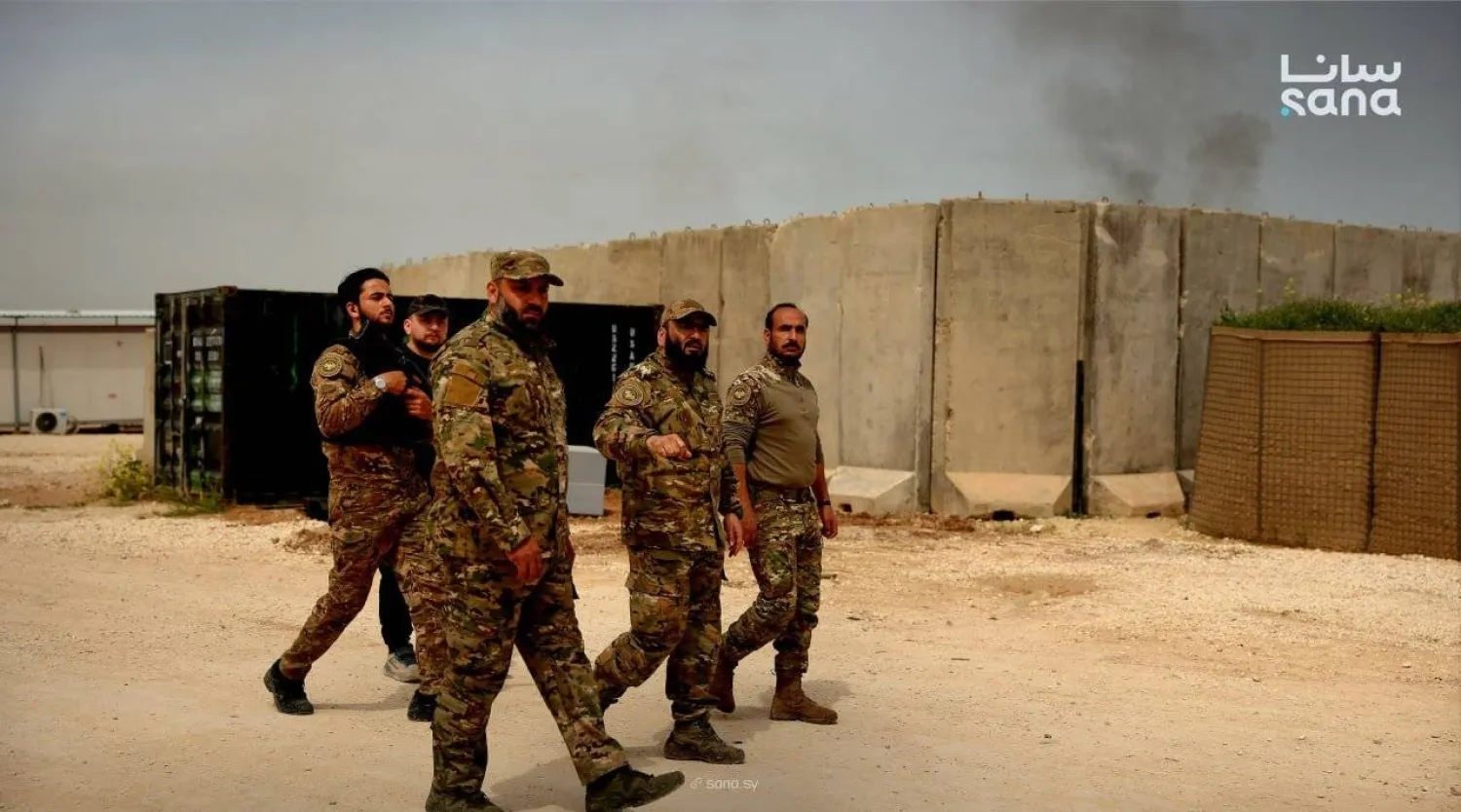 A photo released by Syria’s state news agency SANA shows the army as it takes control of the base (SANA).