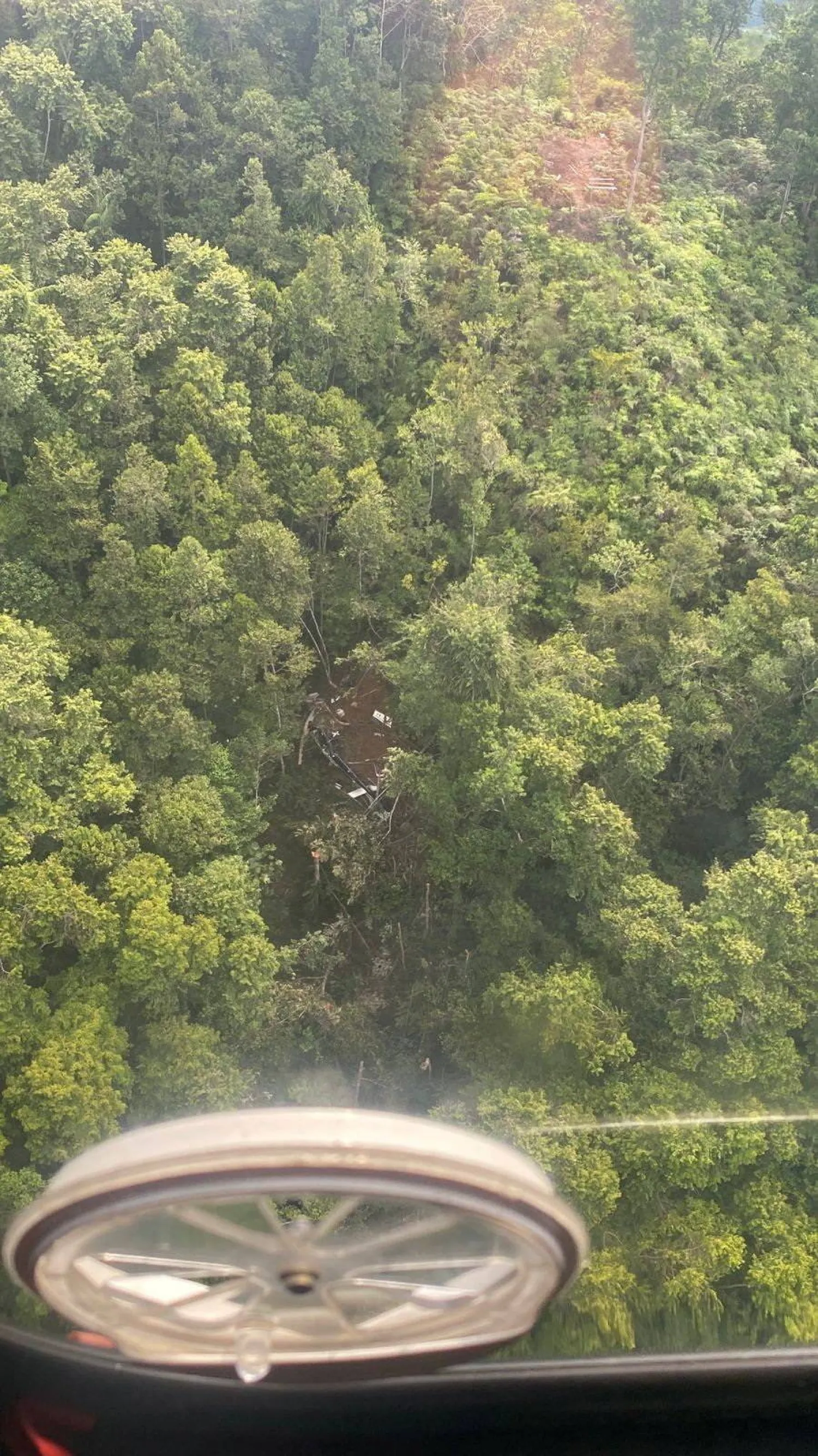 Debris at the site of a helicopter crash in Sekadau regency, West Kalimantan province, Indonesia, April 16, 2026. Picture taken through a window. Indonesia's National Search and Rescue Agency (BASARNAS)/Handout via REUTERS