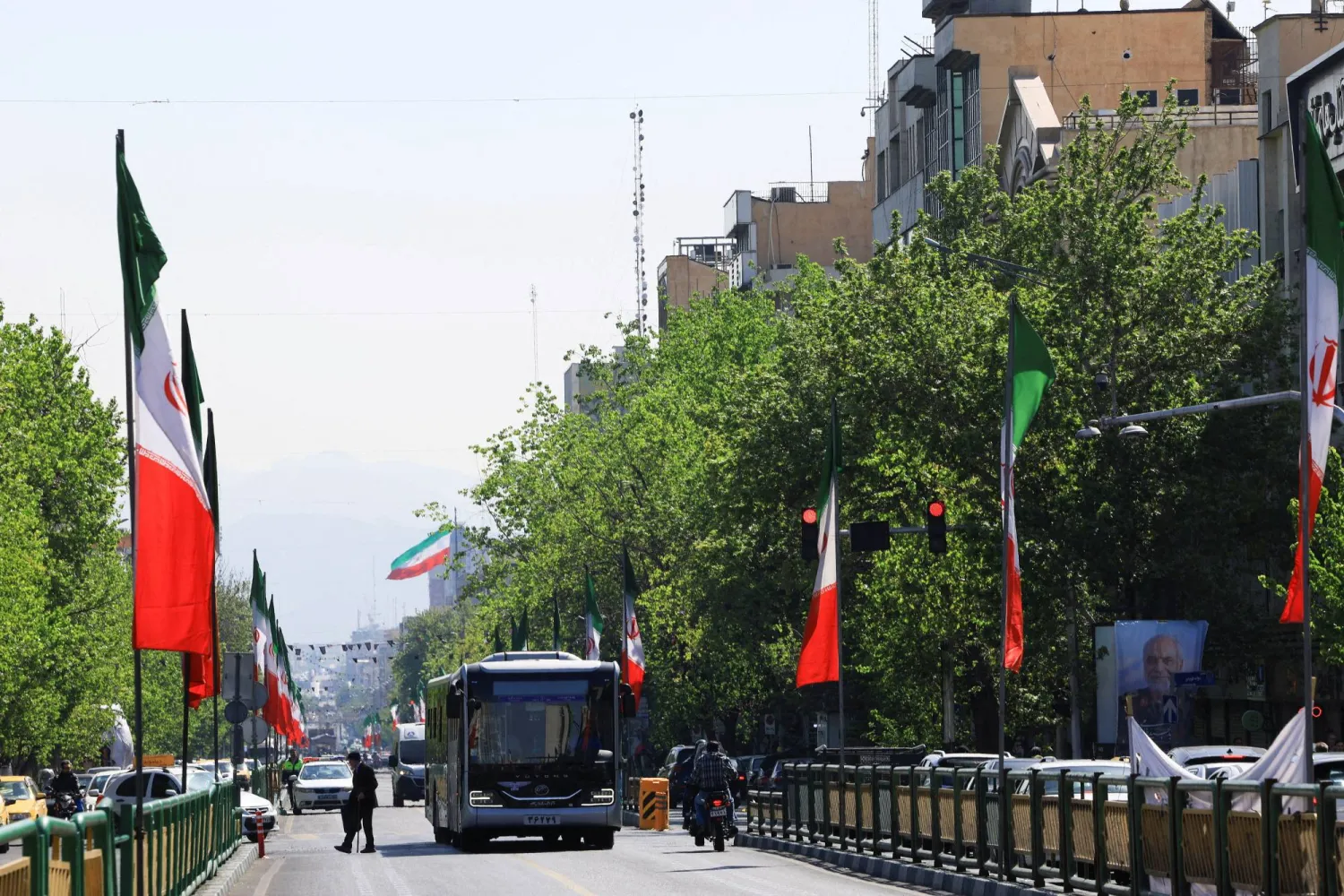 A street lined with Iranian flags in Tehran, Iran, April 16, 2026. REUTERS/Thaier Al-Sudani  