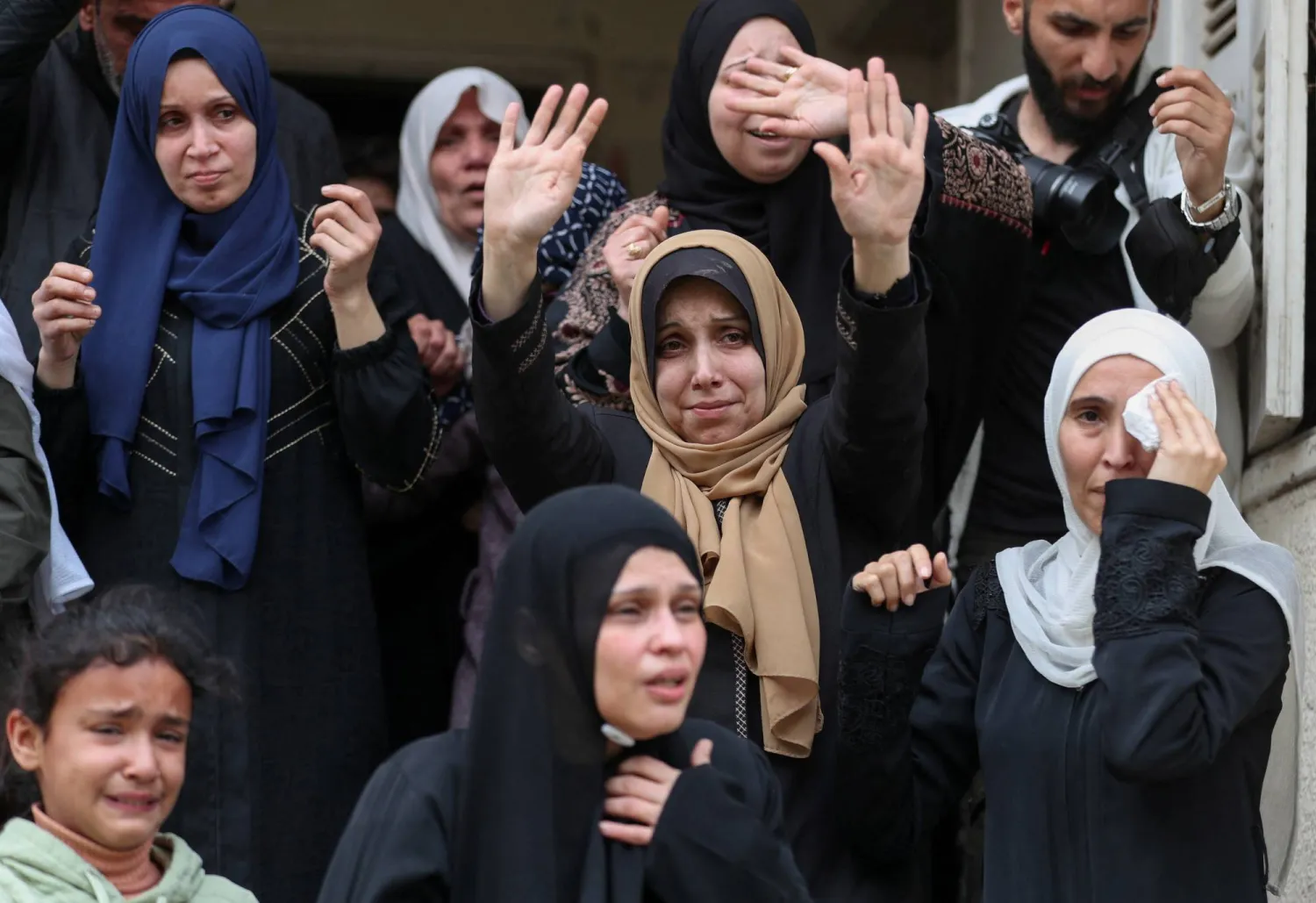 Mourners react during the funeral of Palestinians who were killed in an Israeli strike that took place on Tuesday, according to medics, at Al-Shati camp in Gaza City, April 15, 2026. REUTERS/Dawoud Abu Alkas