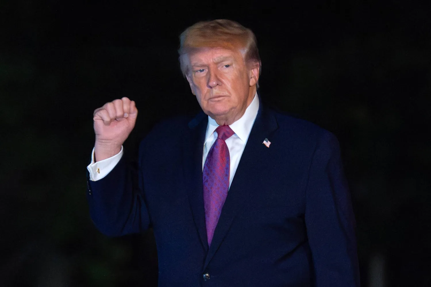 President Donald Trump waves to reporters as he walks on the South Lawn upon his arrival to the White House, Friday, April 17, 2026, in Washington. (AP Photo/Jose Luis Magana)