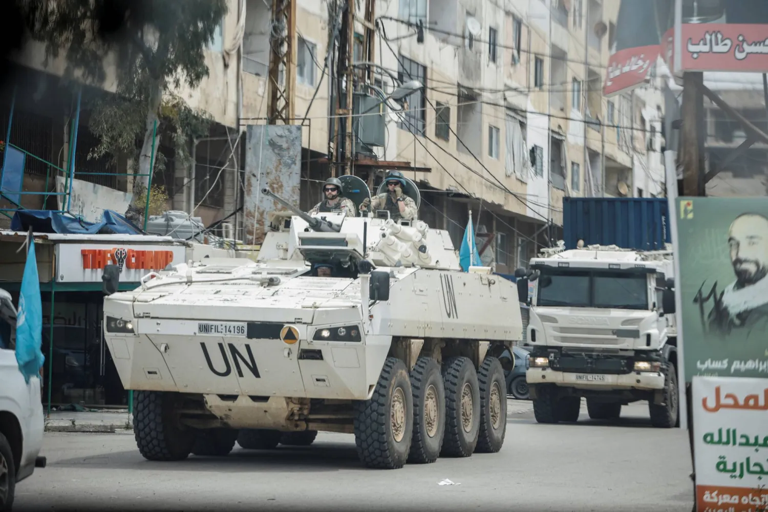 A UNIFIL convoy rides through the town, as seen through the window of a vehicle, in Tyre, south Lebanon, April 15, 2026. REUTERS/Louisa Gouliamaki