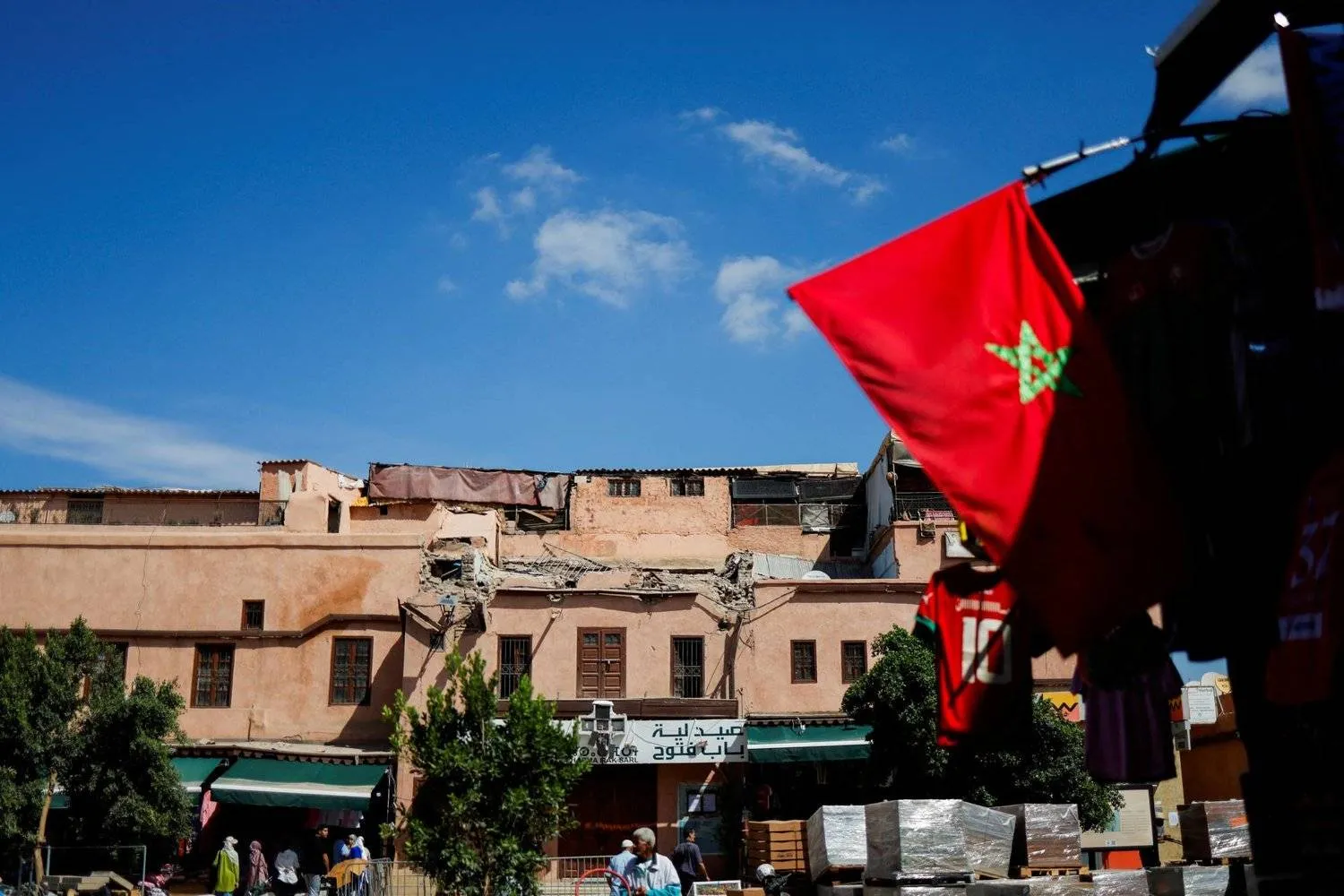 The Moroccan flag is seen in front of a destroyed building following the devastating earthquake in Marrakesh last month. (Reuters) 
