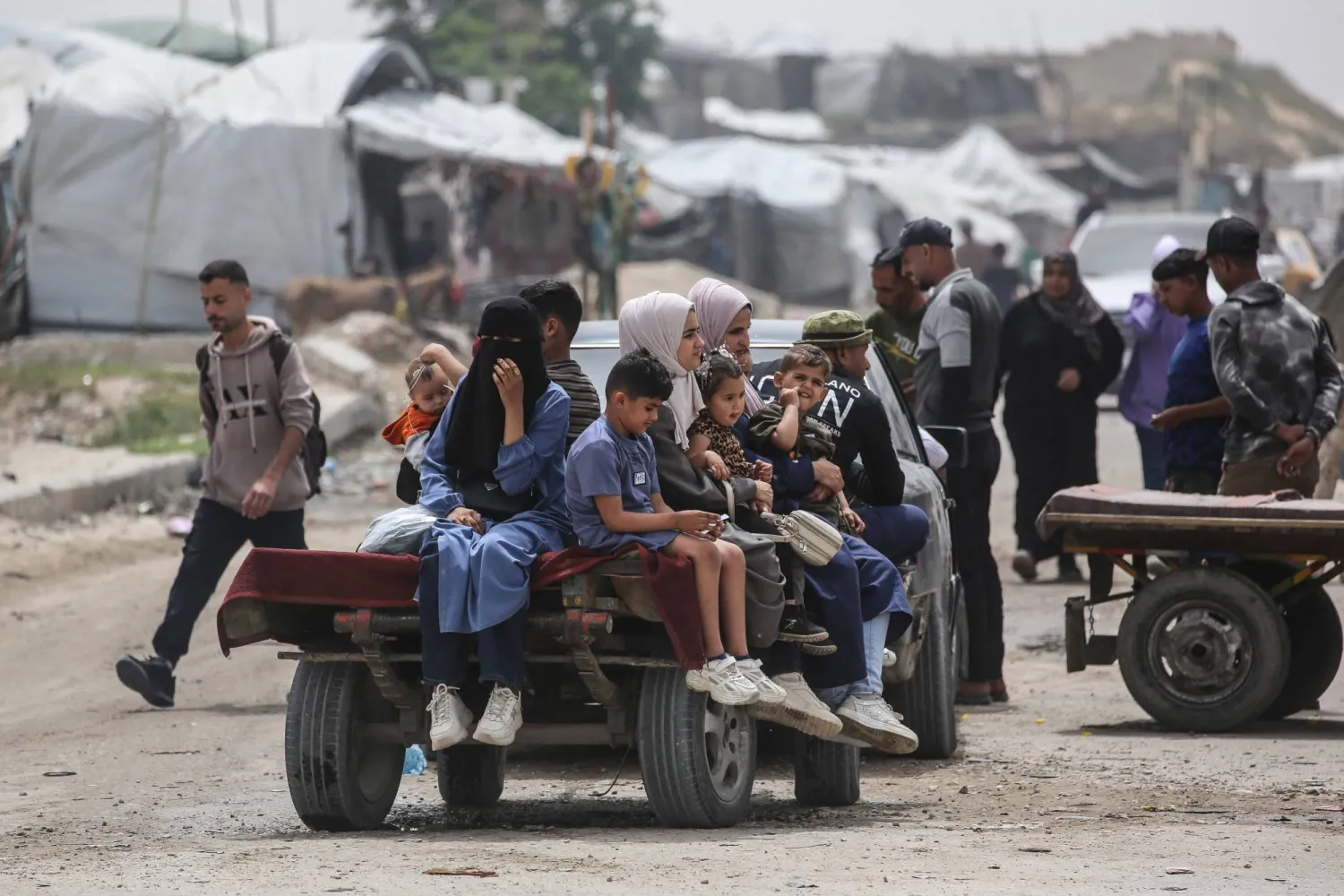 Palestinians in Khan Younis, southern Gaza Strip, on Saturday (AFP)