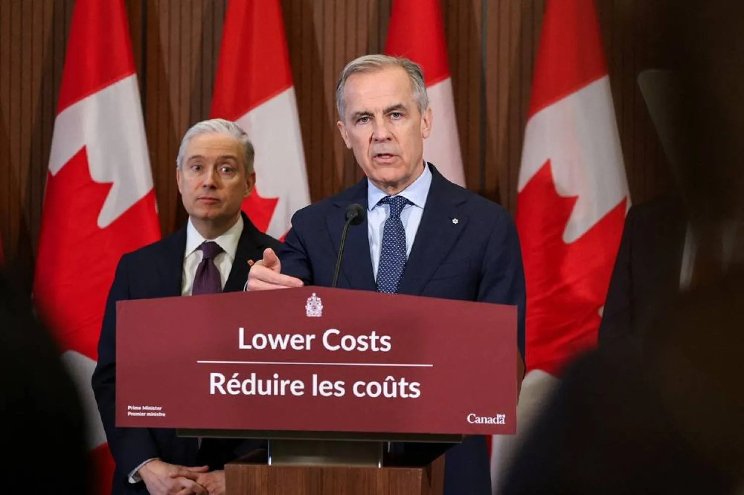 Canada's Prime Minister Mark Carney speaks at a press conference with Minister of Finance and National Revenue Francois-Philippe Champagne, and Minister of Energy and Natural Resources Tim Hodgson (not pictured) on Parliament Hill the day after his governing Liberal Party secured a majority by winning all three seats in special elections, in Ottawa, Ontario, Canada, April 14, 2026. (Reuters) 
