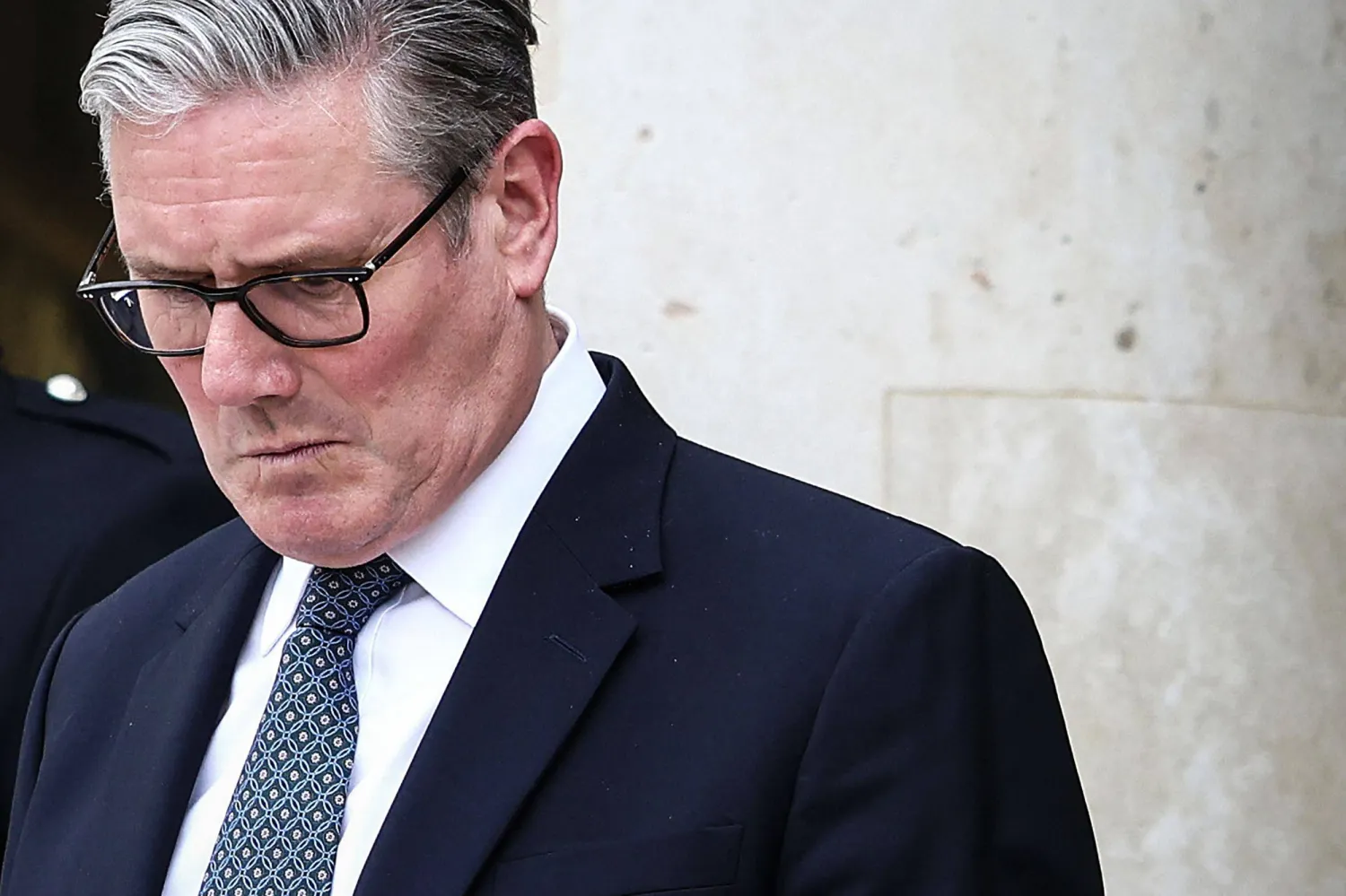 Britain's Prime Minister Keir Starmer reacts as he prepares to leave the Elysee Presidential Palace in Paris on April 17, 2026 following an international summit on efforts to reopen the Strait of Hormuz. (AFP)