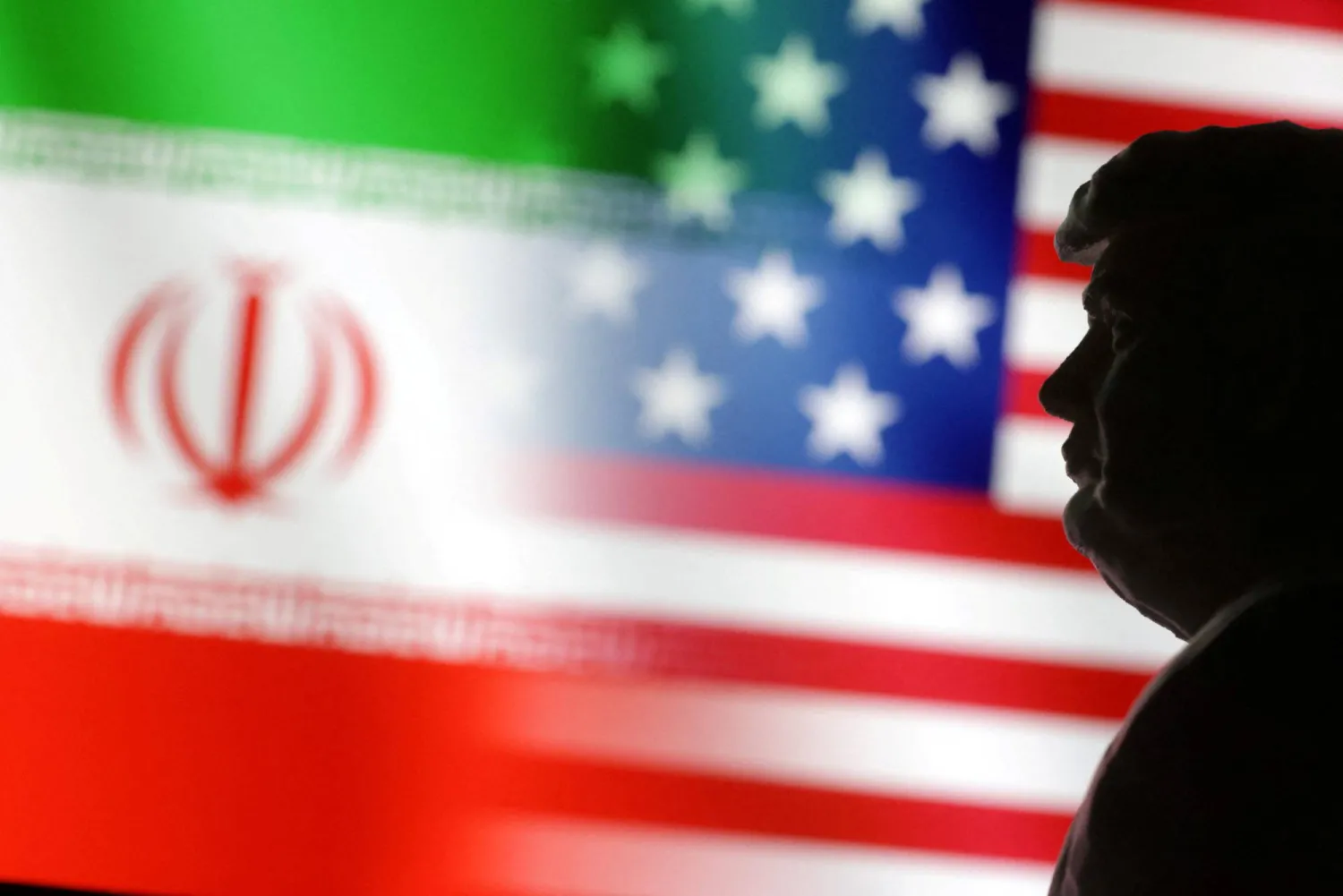 FILE PHOTO: A 3D-printed miniature model of Donald Trump and the US and Iran flags are seen in this illustration taken January 15, 2025. REUTERS/Dado Ruvic/Illustration/File Photo