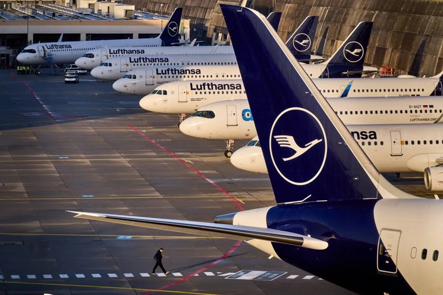 A man walks past parked Lufthansa aircraft at the airport as Lufthansa pilots are on a two-day strike, in Frankfurt, Germany, Thursday, March 12, 2026. (AP)