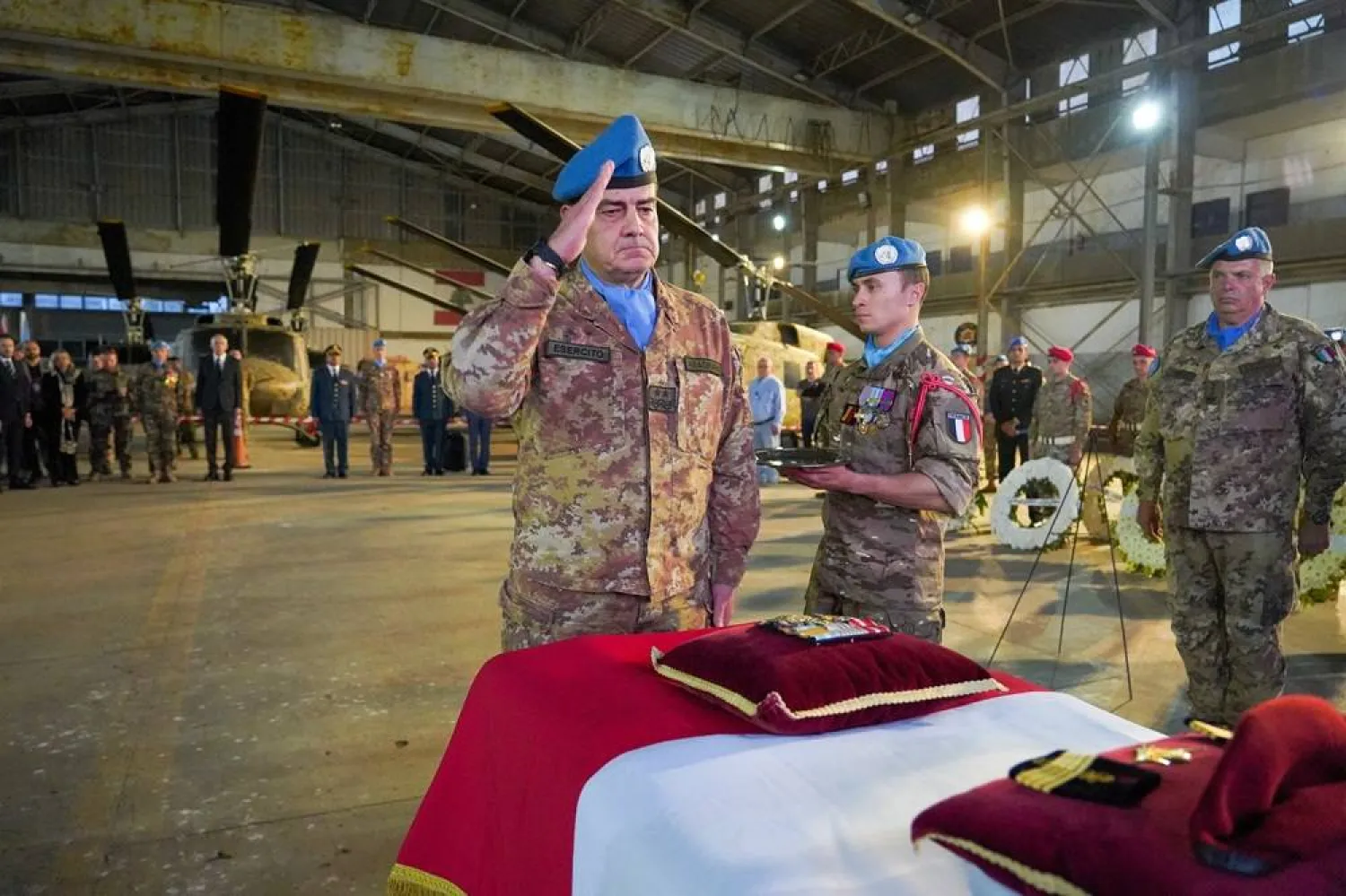 UNIFIL Head of Mission and Force Commander Major General Diodato Abagnara pays tribute to Sergeant-Chef Florian Montorio, who was killed while clearing a road in southern Lebanon in an attack that UNIFIL peacekeepers and French officials said was likely carried out by Hezbollah, at Beirut-Rafic Hariri International Airport in Beirut, Lebanon, April 19, 2026. (Haidar Fahs/UNIFIL/Handout via Reuters)