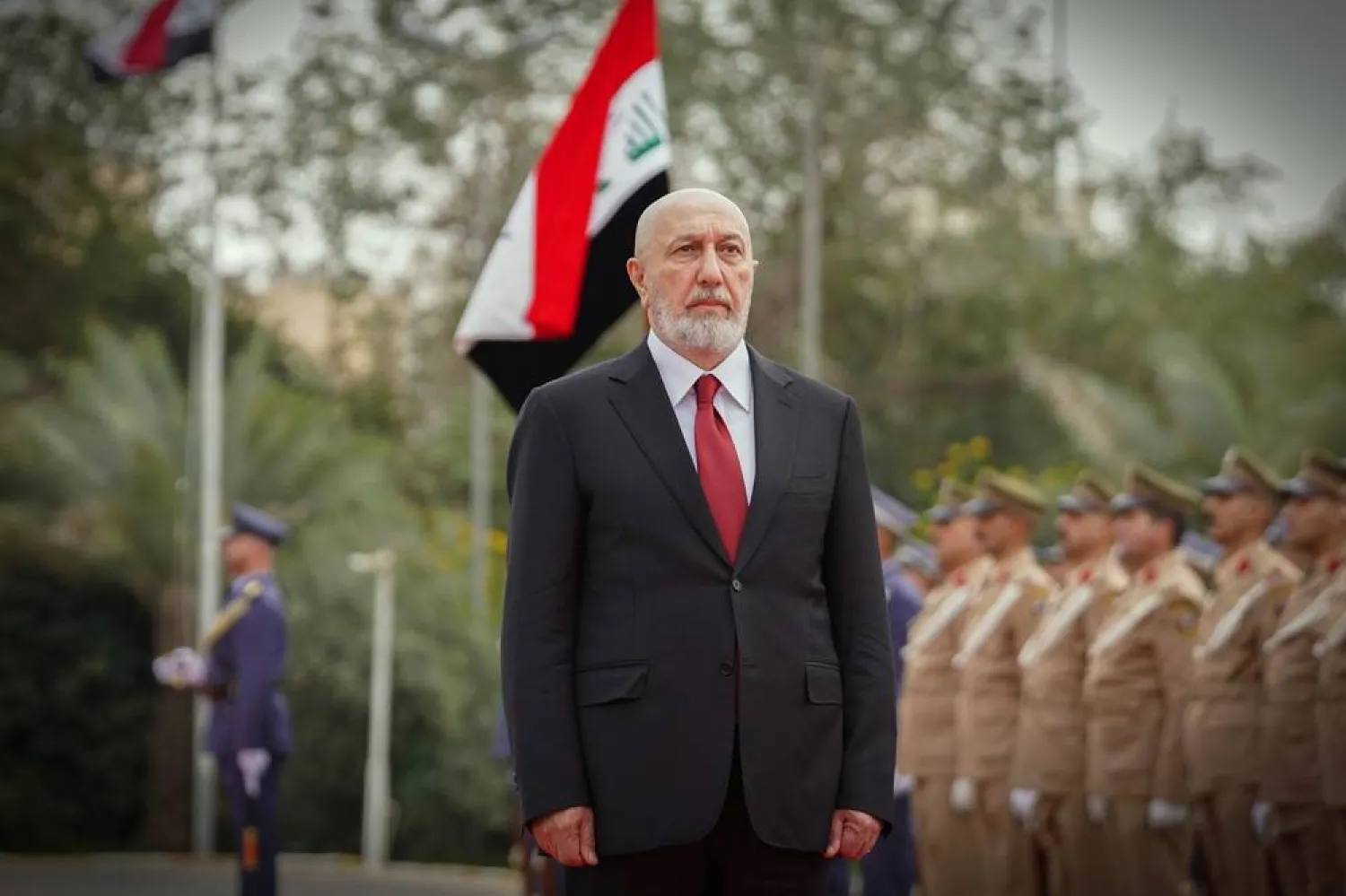  In this photo released by official website of the Iraqi Presidency Office, newly elected President Nizar Amidi inspects an honor guard during his ceremonial reception at the Peace Palace in Baghdad, Sunday, April 12, 2026. (Iraqi Presidency Office via AP) 