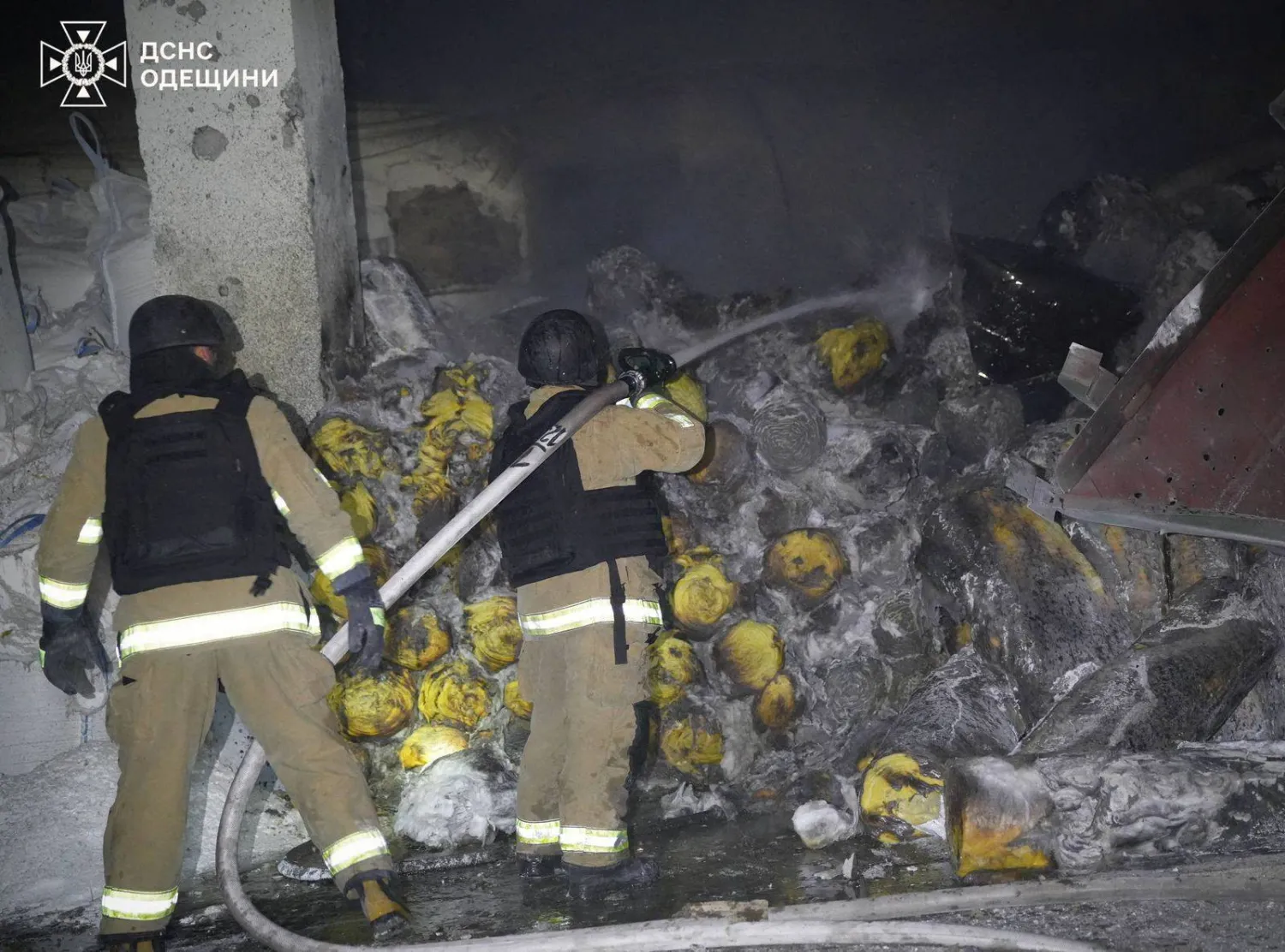 Rescuers work at the site of a Russian drone strike as port infrastructure was hit, amid Russia's attack on Ukraine, in Odesa region, Ukraine April 22, 2026. (Press service of the State Emergency Service of Ukraine in Odesa region/Handout via Reuters) 