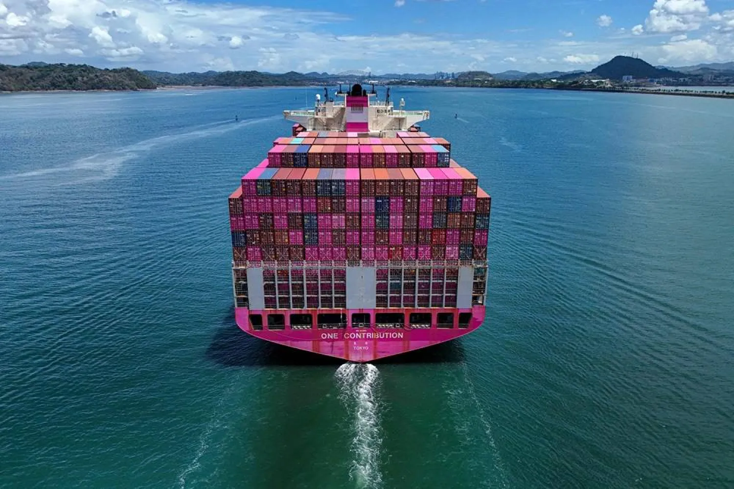 Aerial view of the One Contribution container ship sailing under the Tokio flag as it enters the Panama Canal in Panama City on April 21, 2026. (EPA)