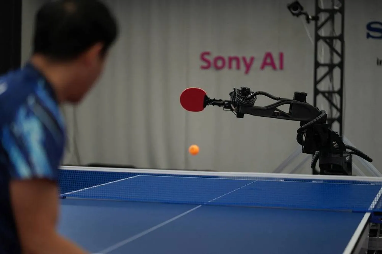 Sony AI autonomous robot Ace returns a shot back against its human opponent, table tennis player Yamato Kawamata, during a match in December 2025, as seen in this photograph released on April 22, 2026. (Sony AI/Handout via Reuters)