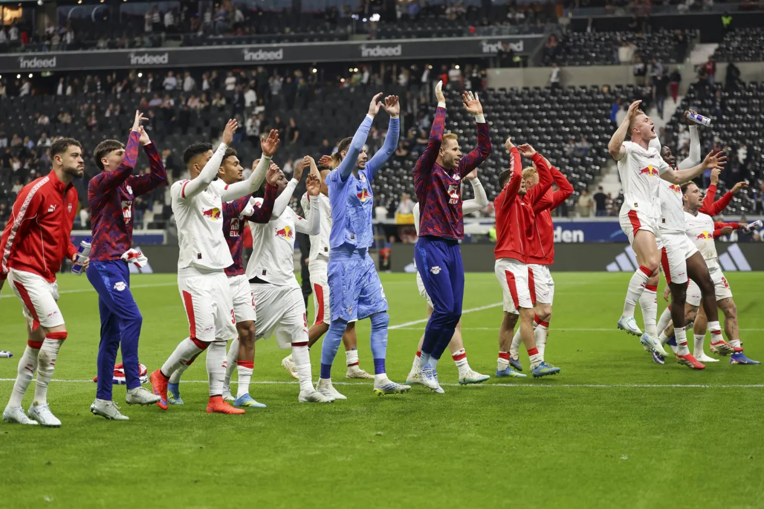 Players of RB Leipzig celebrate with their supporters after winning the German Bundesliga soccer match between Eintracht Frankfurt and RB Leipzig in Frankfurt, Germany, 18 April 2026. EPA/CHRISTOPHER NEUNDORF