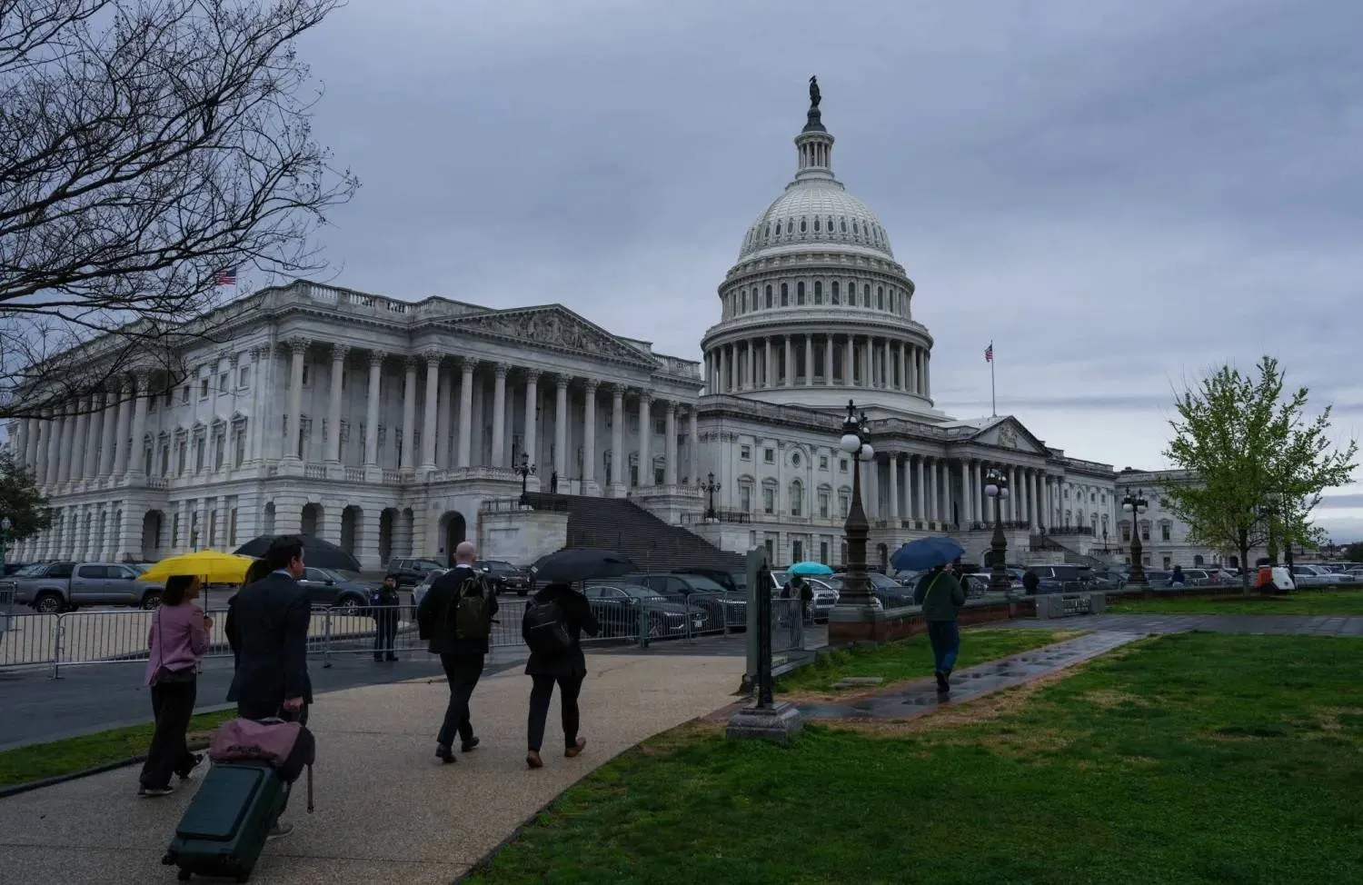 Passersby near the United States Capitol (Reuters)