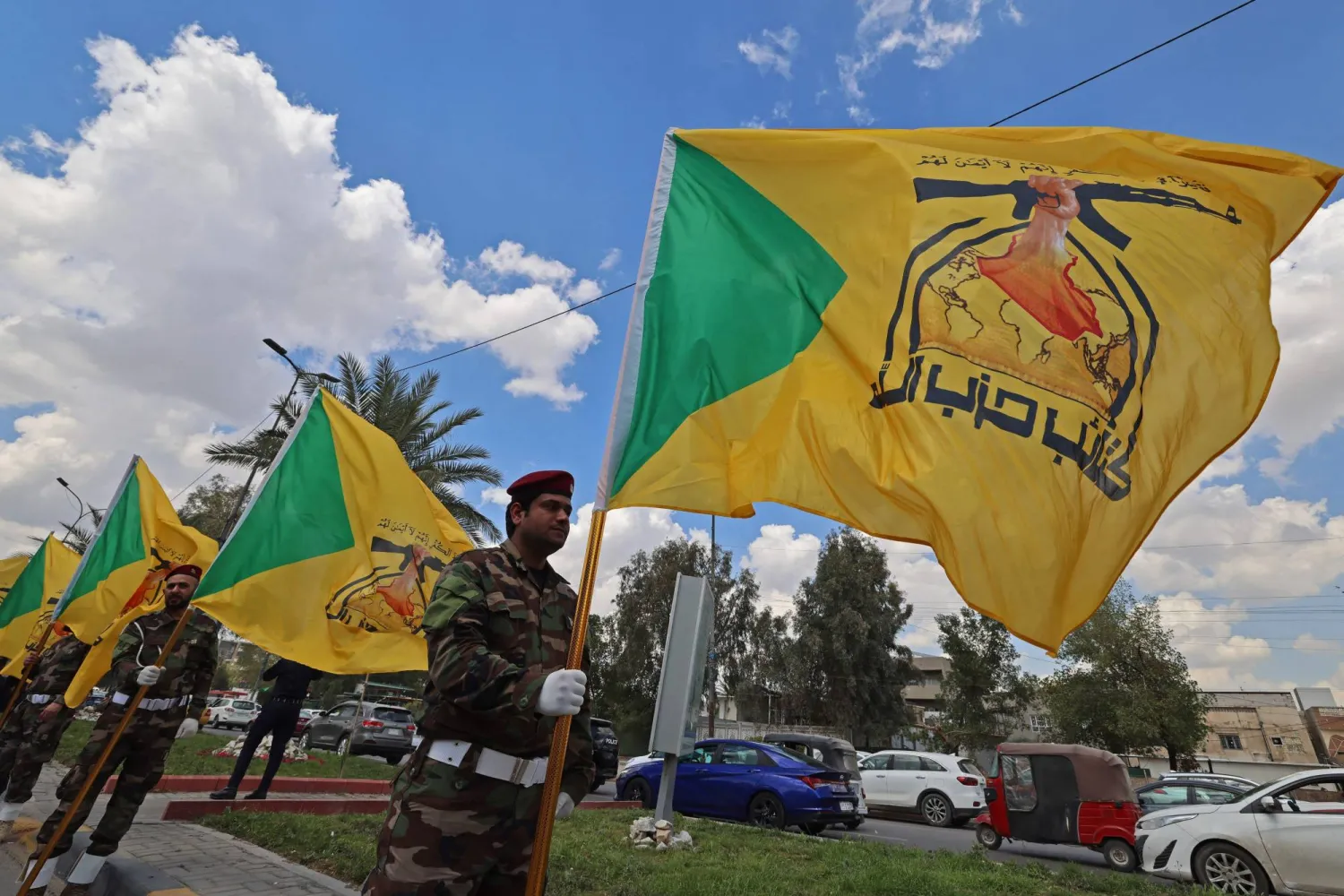 Members of Iraq's pro-Iran Hezbollah Brigades (Kataib Hezbollah) gather in a mourning procession for one of their comrades who was killed the previous day in a strike in Basra, during the funeral in Baghdad on April 8, 2026. (Photo by AHMAD AL-RUBAYE / AFP)