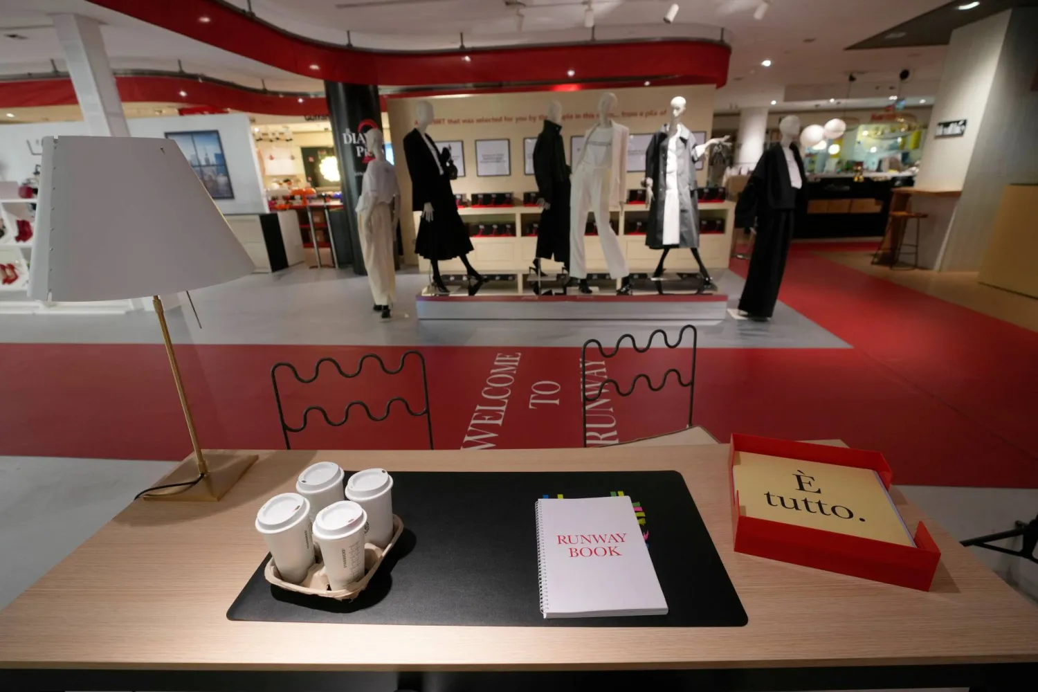 An installation of the new movie 'Devil Wears Prada 2' is displayed at La Rinascente shopping center, in Milan, Italy, Monday, April 20, 2026. (AP Photo/Luca Bruno)