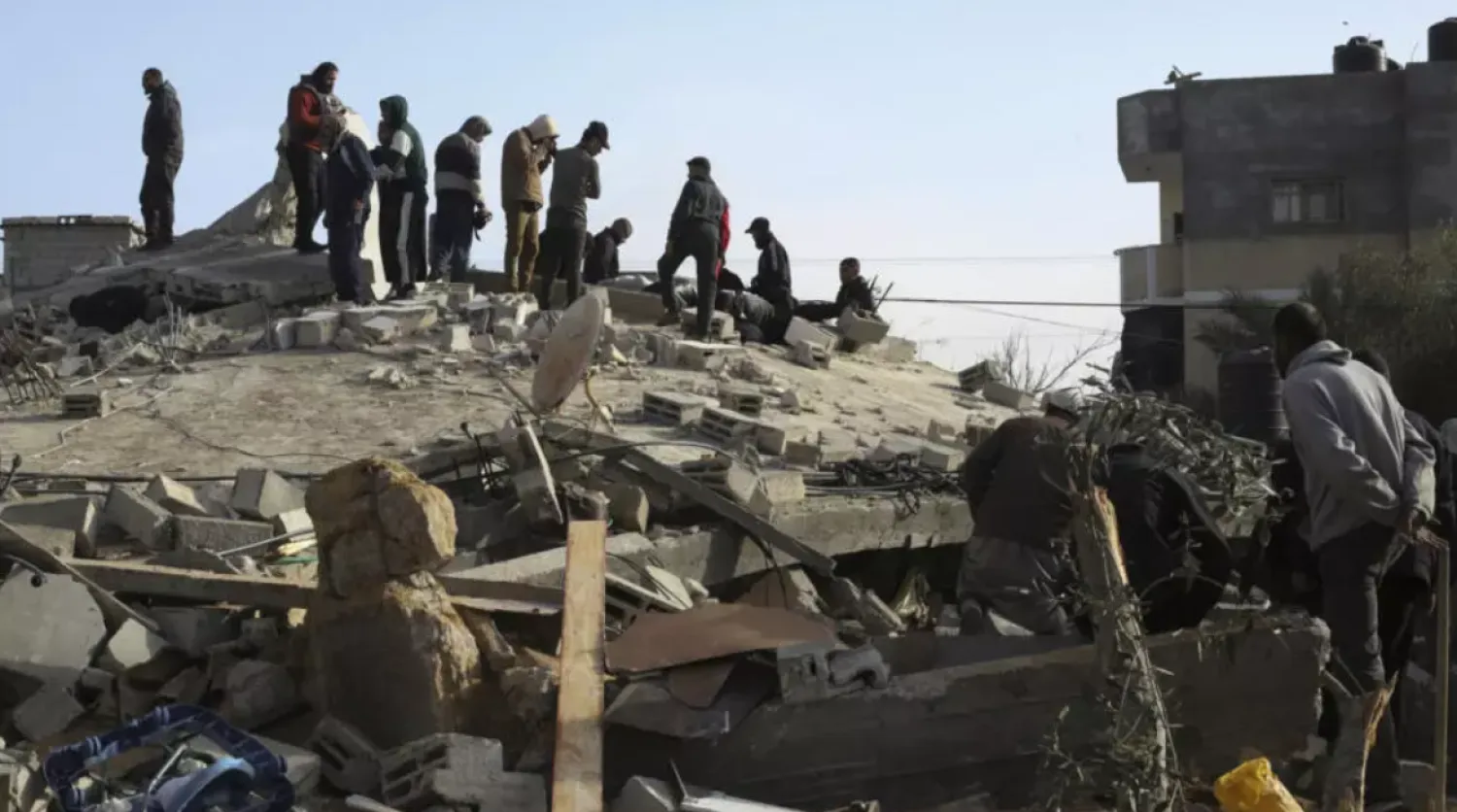 Palestinians examine the destruction after an Israeli strike on a residential building in Rafah, Gaza Strip on March 3, 2024. © Hatem Ali, AP
