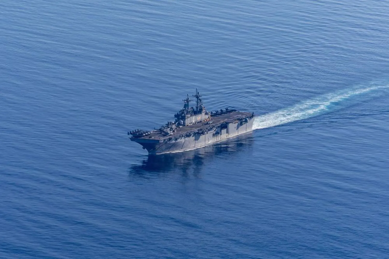 This handout photo from the US Navy shows the Wasp-class amphibious assault ship USS Boxer (LHD 4) sailing in the Pacific Ocean.. (AFP)