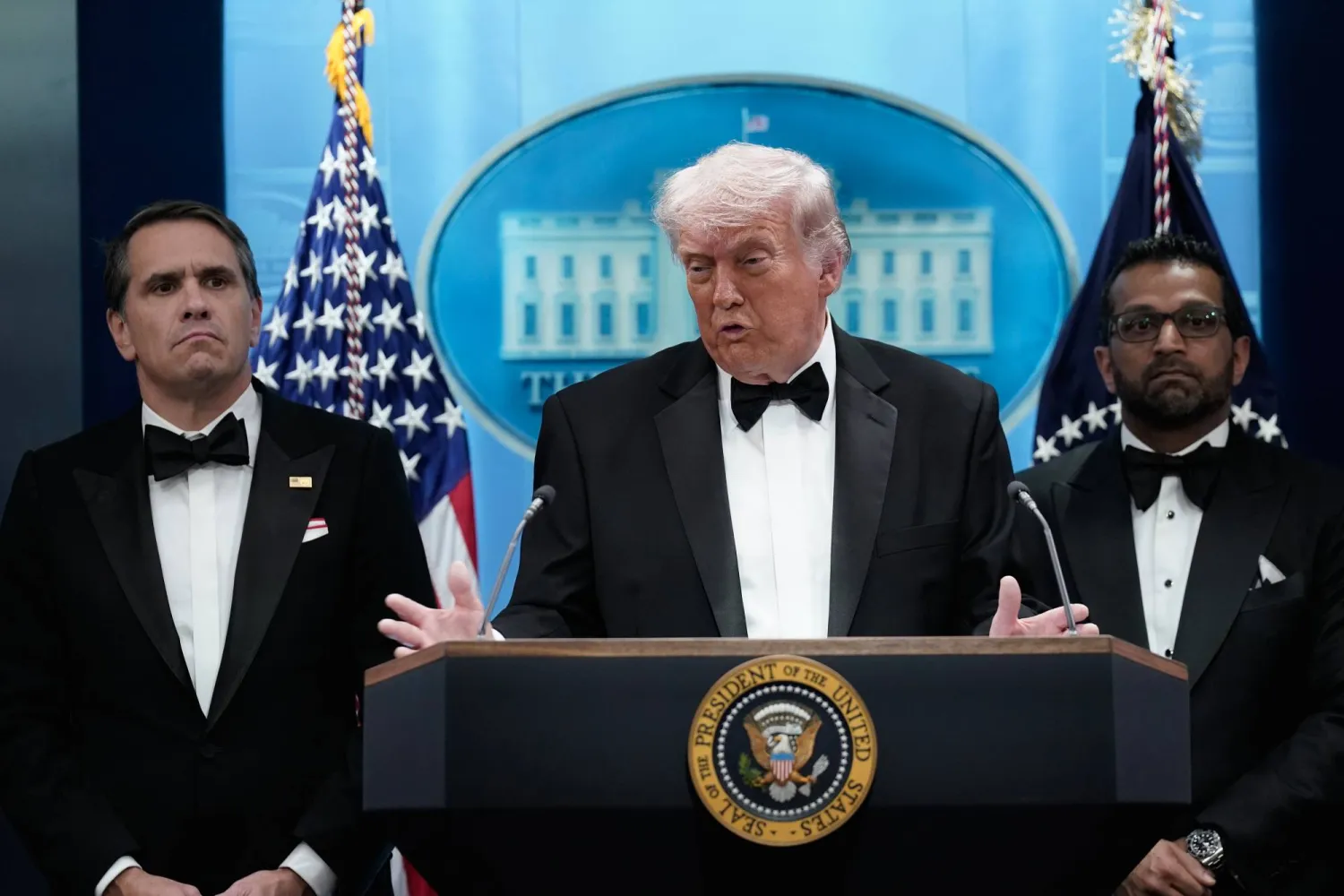 President Donald Trump speaks in the James Brady Press Briefing Room at the White House after an unspecified threat at the annual White House Correspondents' Association Dinner in Washington, Saturday, April 25, 2026, as acting Attorney General Todd Blanche and FBI director Kash Patel listen. (AP Photo/Jose Luis Magana)