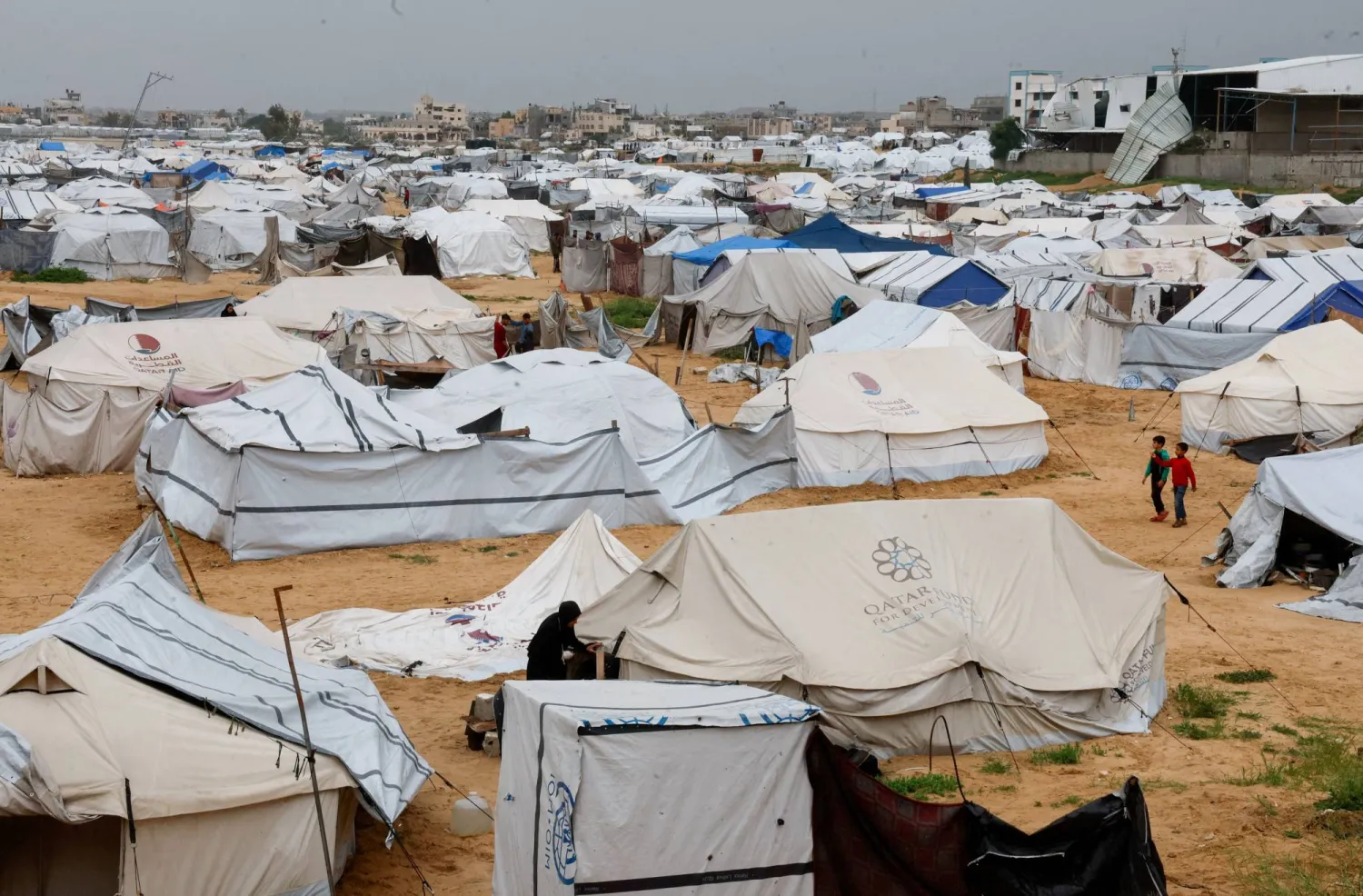 FILE PHOTO: Displaced Palestinians shelter in a tent camp on a windy day in Khan Younis in the southern Gaza Strip, April 2, 2026. REUTERS/Haseeb Alwazeer/File Photo